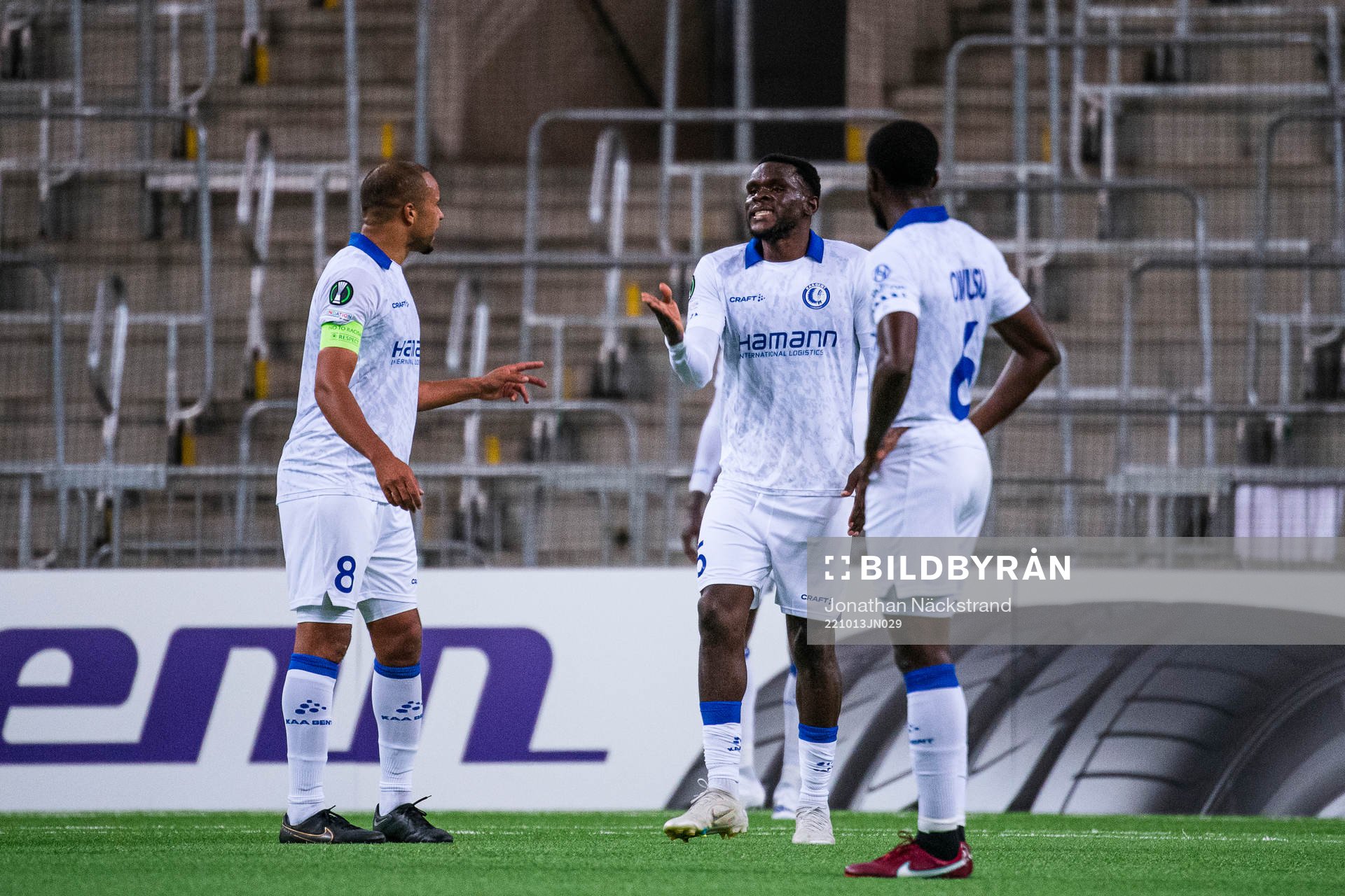 Vadis Odjidja-Ofoe and Michael Ngadeu of Gent react