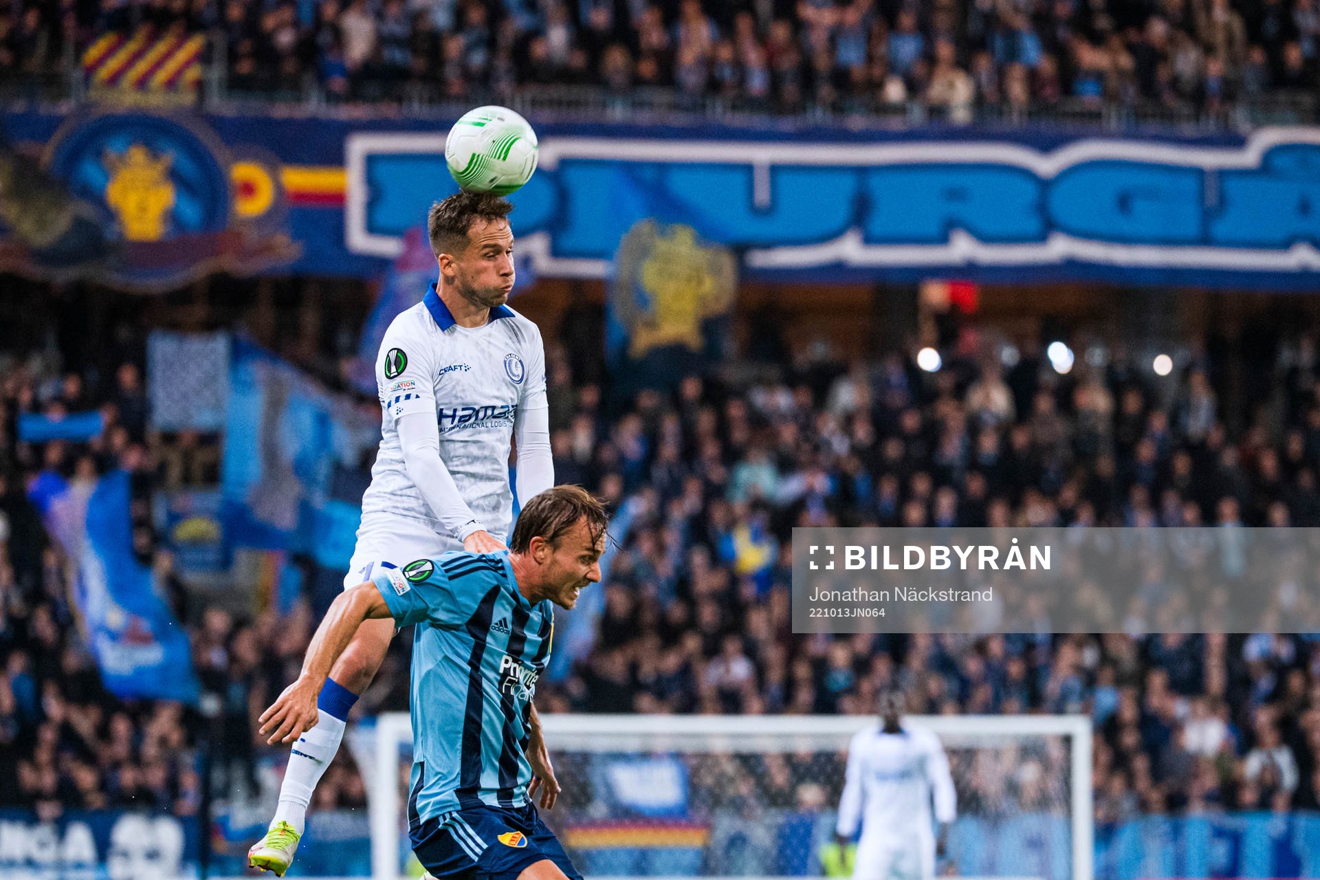Andrew Hjulsager of Gent heads the ball over Pierre