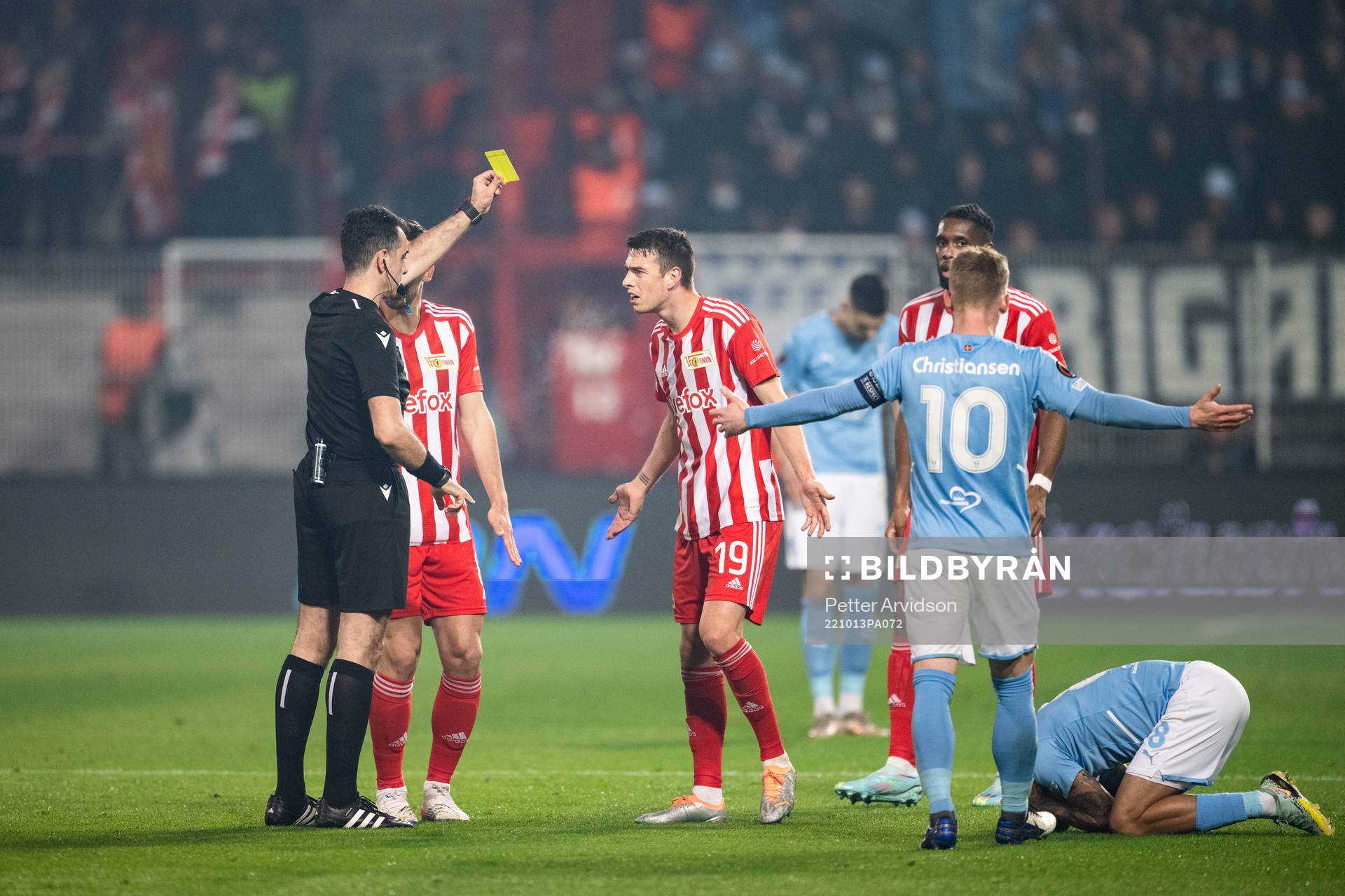 Janik Haberer of Union Berlin receives a yellow card