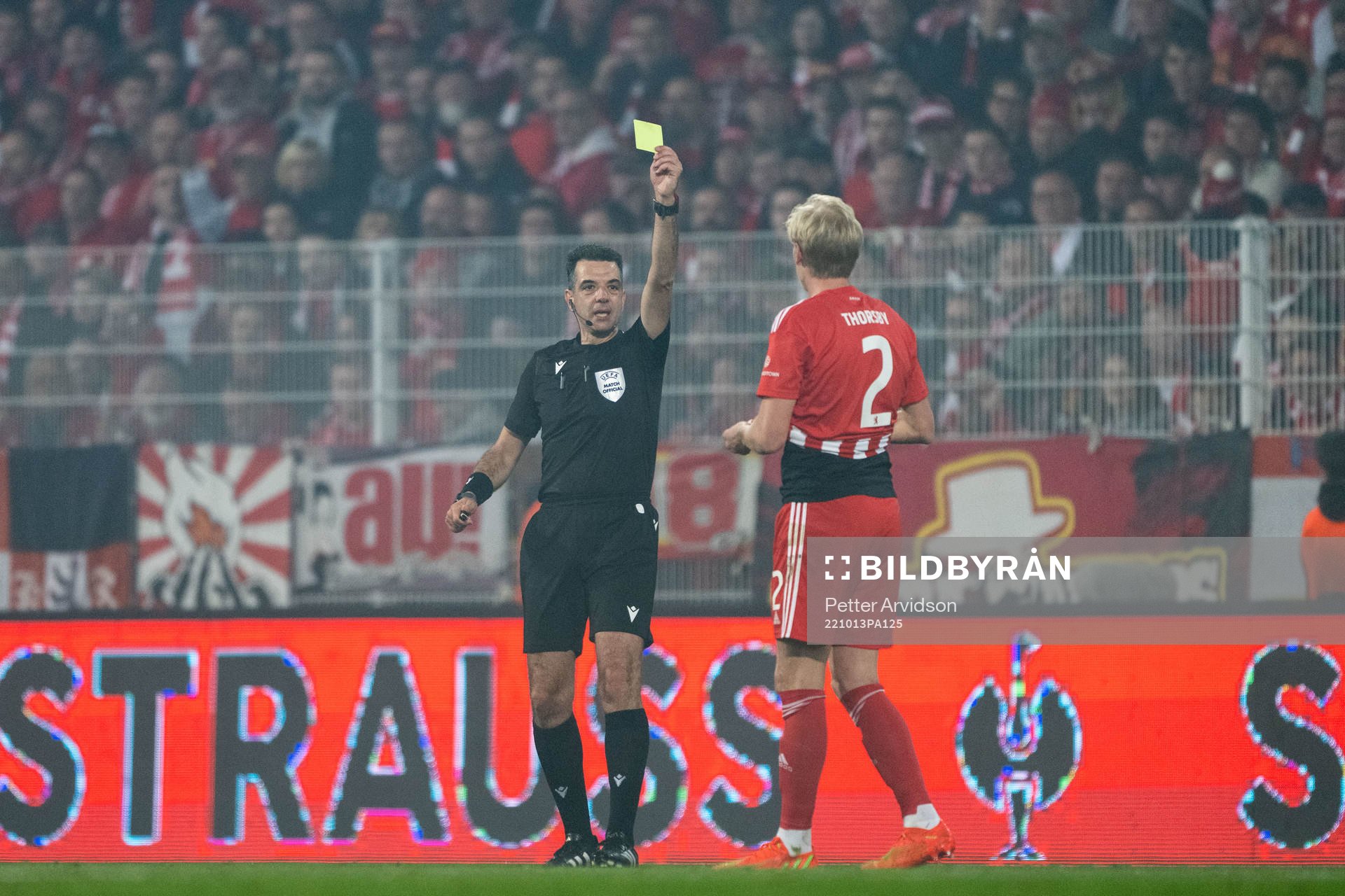 Morten Thorsby of Union Berlin receives a yellow card for