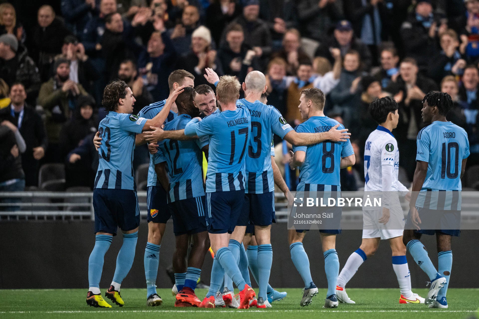 Players of Djurgården celebrate with Emmanuel Justine