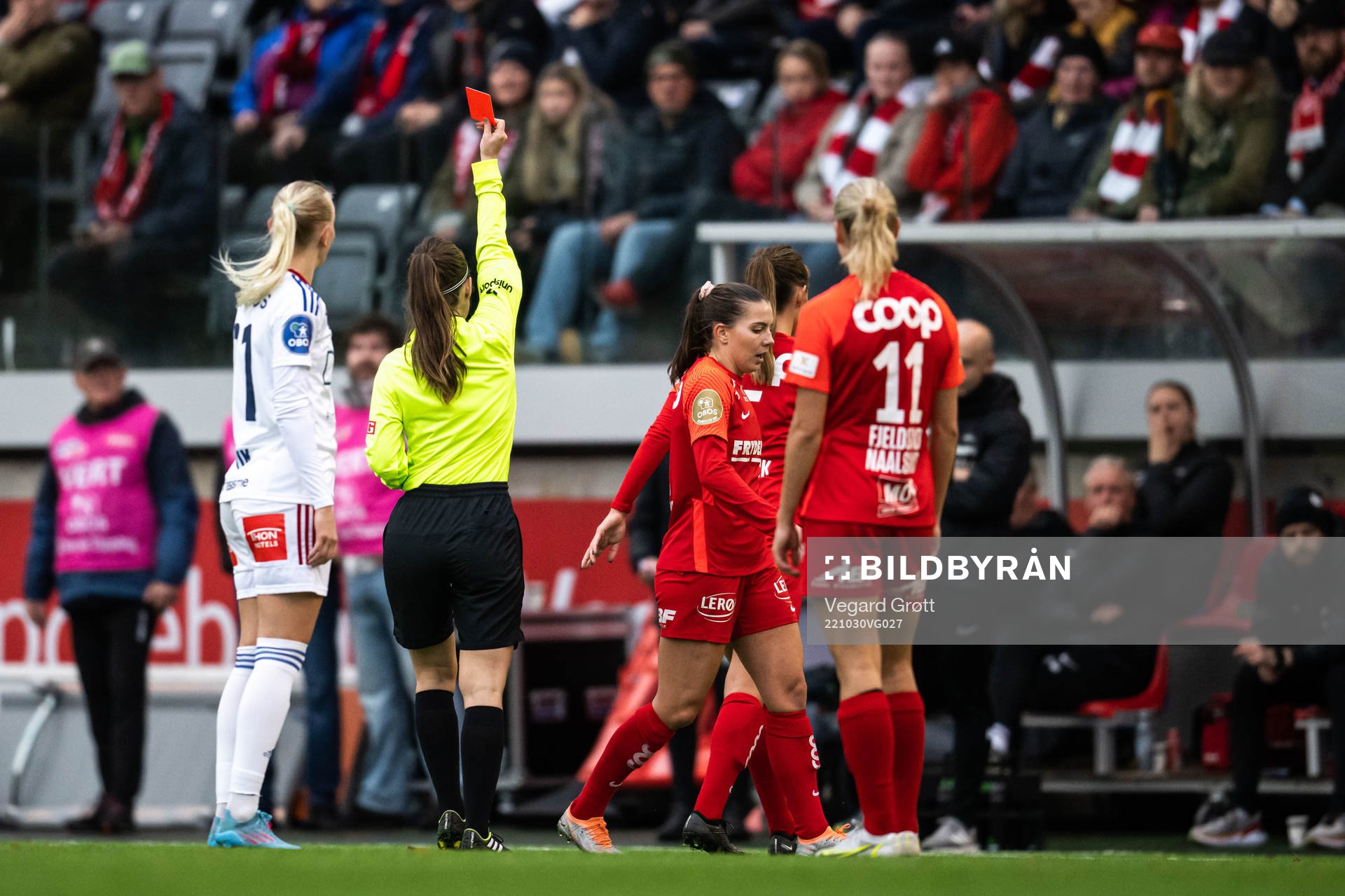 Referee Henrikke Holm Nervik shows a red card