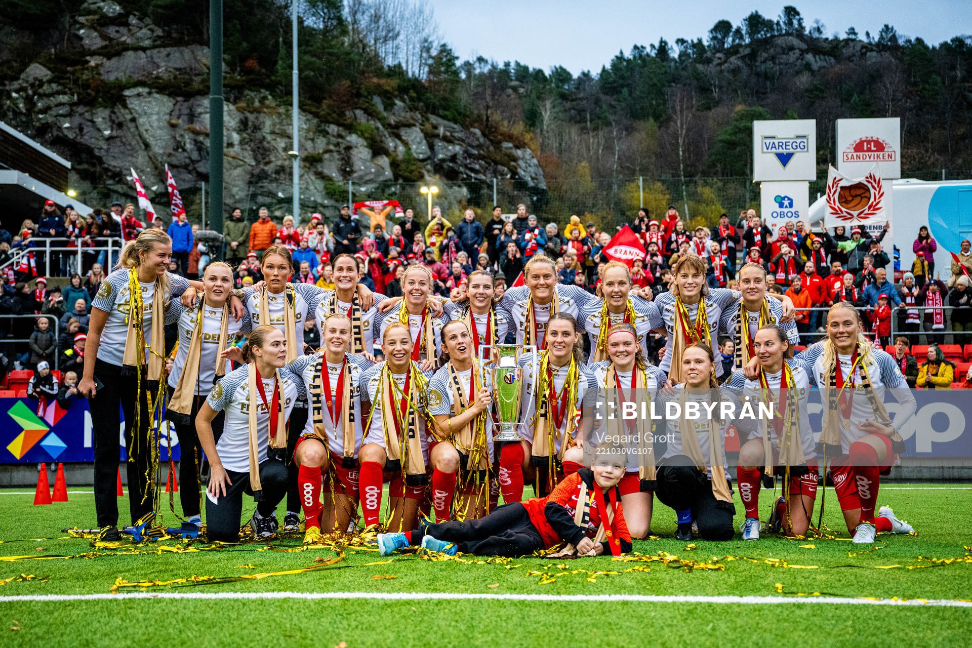 Players of Brann celebrate with the trophy