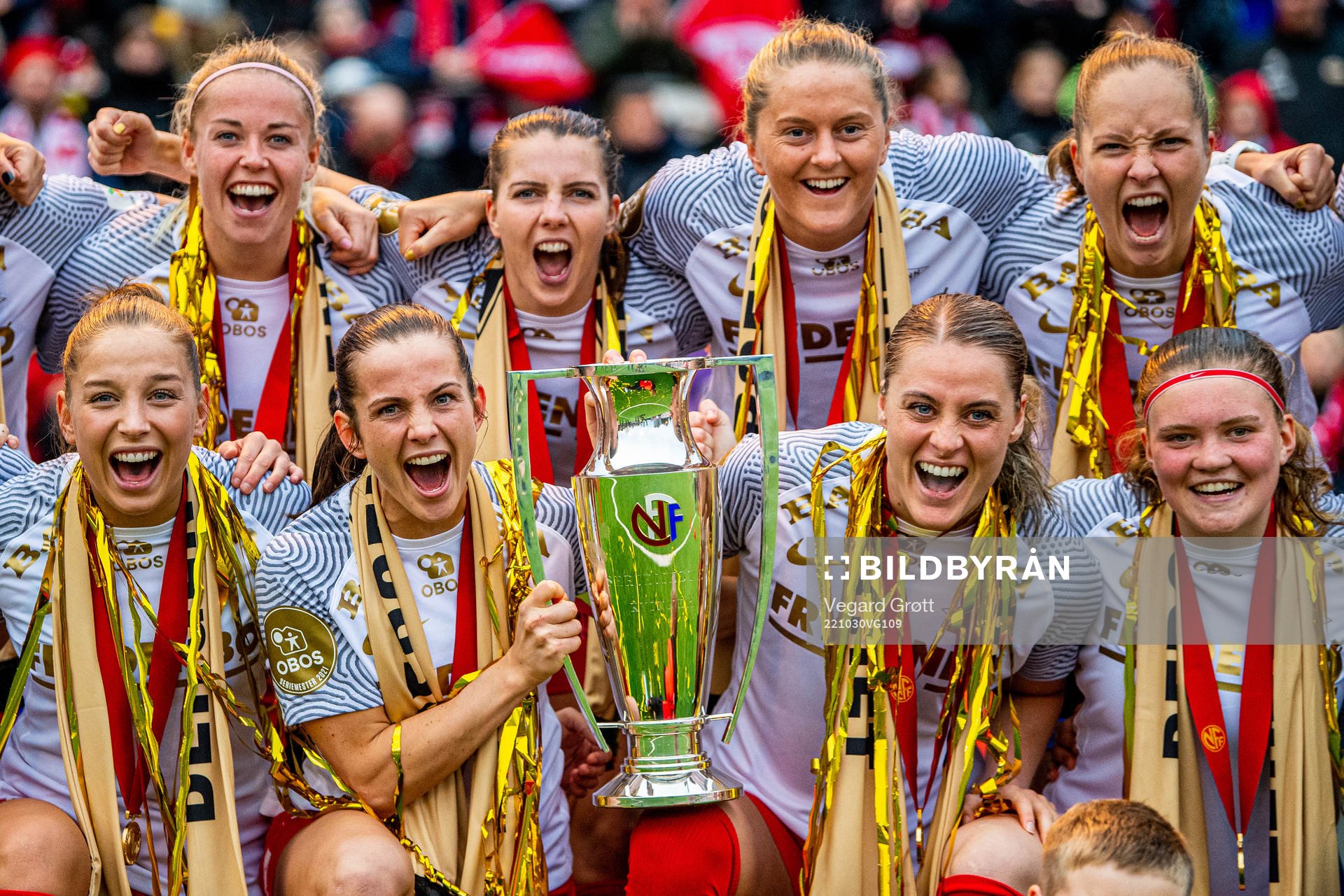Players of Brann celebrate with the trophy