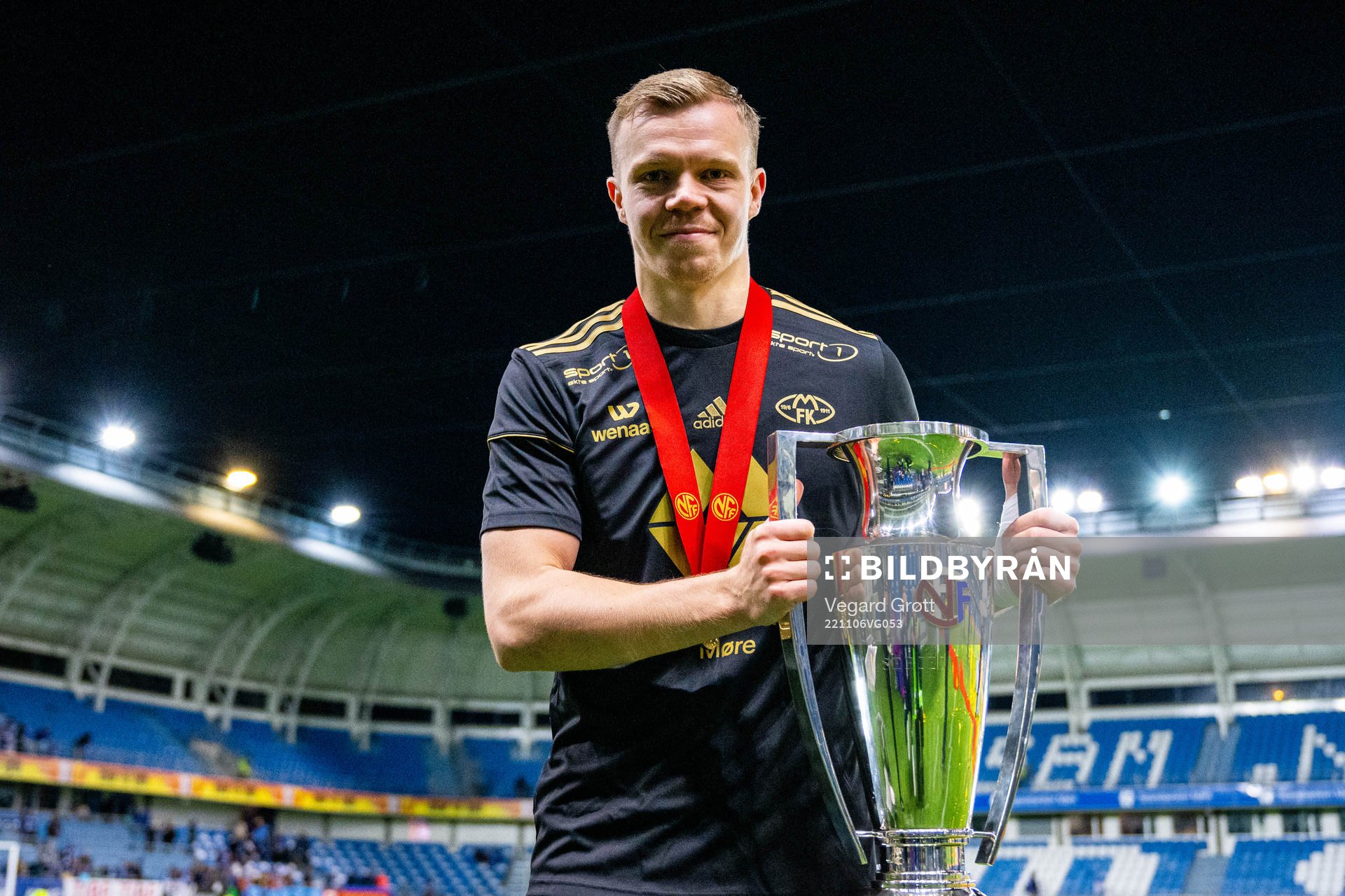 Eirik Haugan of Molde celebrates with the trophy