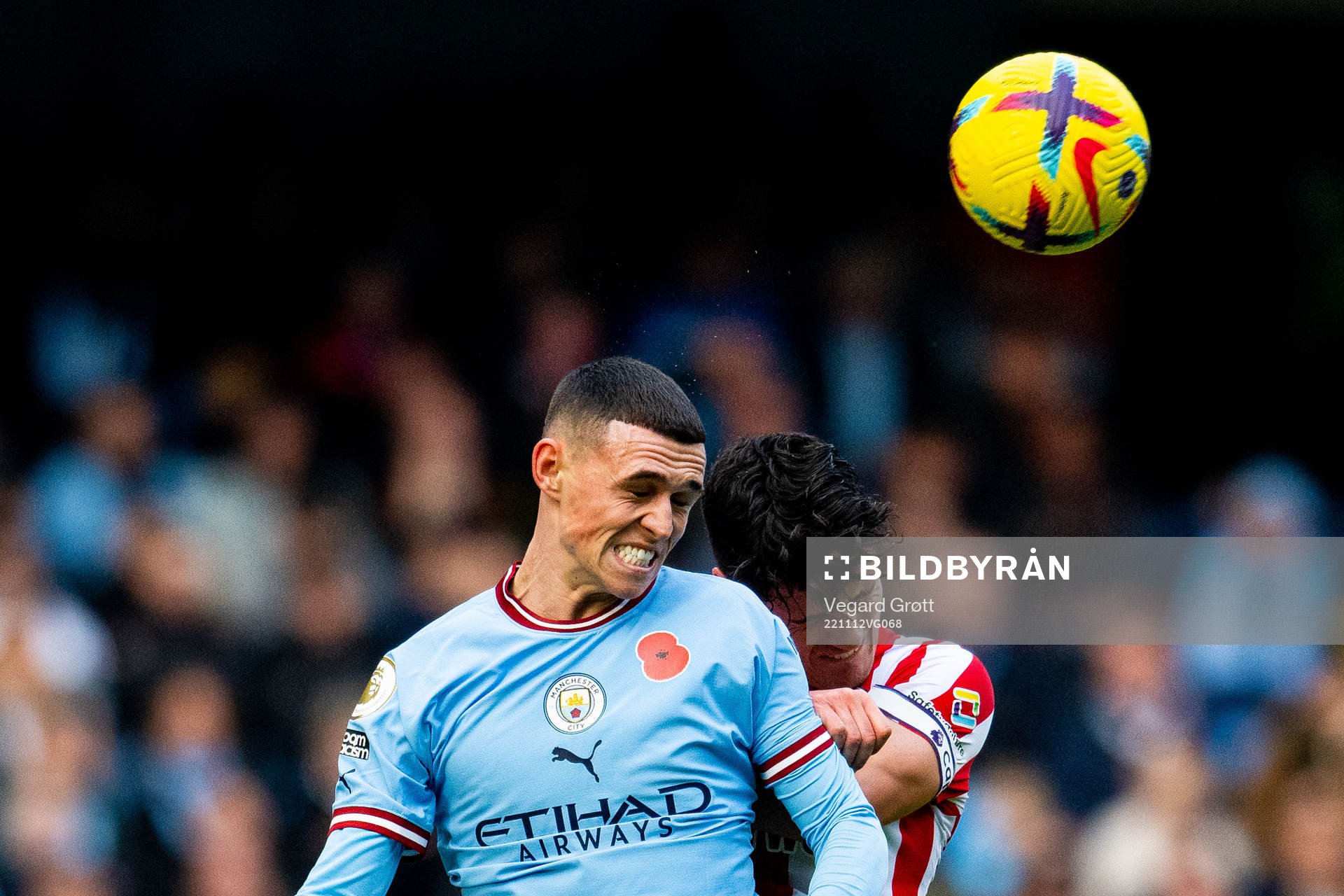 Phil Foden of Manchester City and Christian Nørgaard of Brentford during the Premier League football match between Manchester City and Brentford on November 12, 2022 in Manchester.