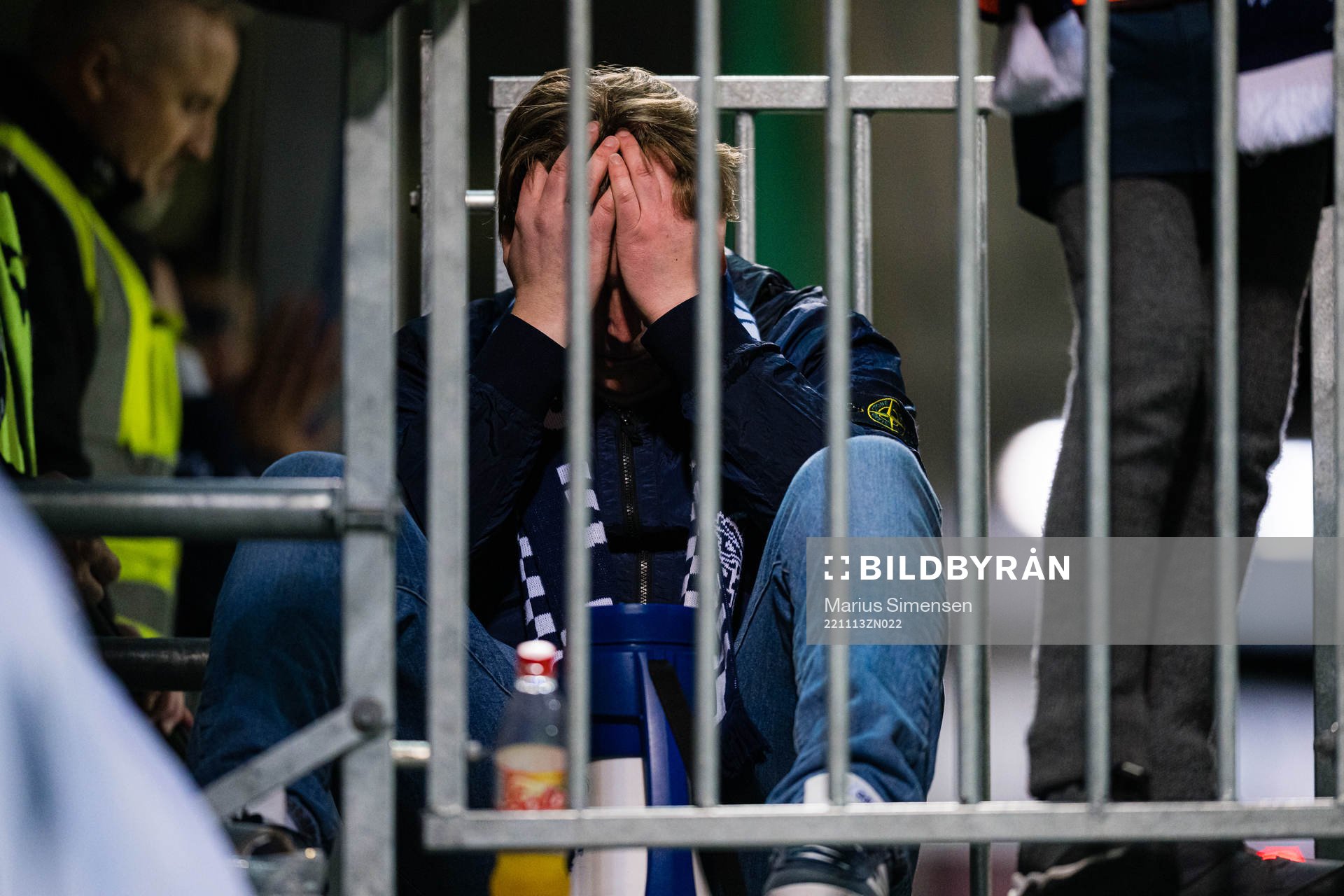 Spectators in the stands looks dejected