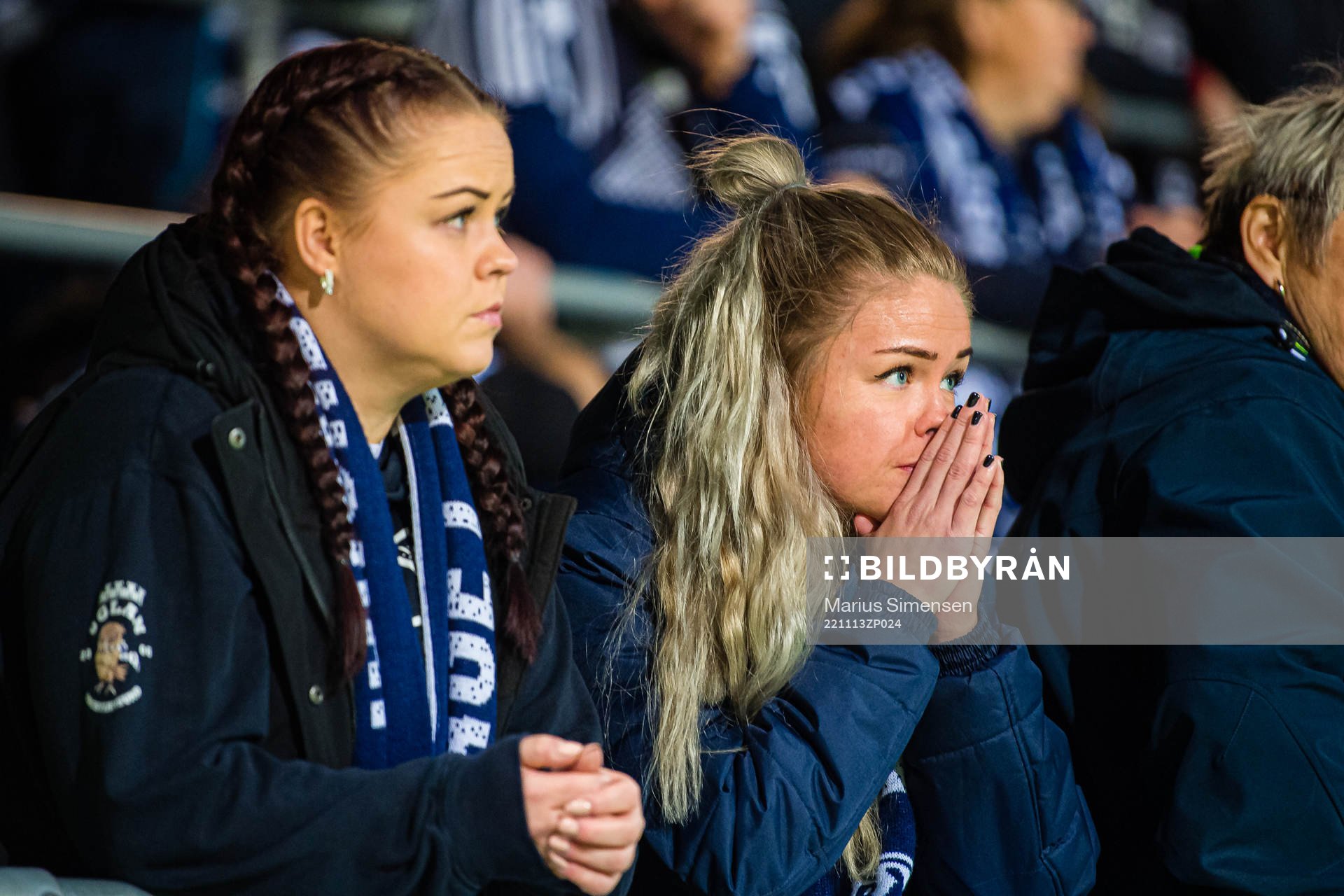 Spectators in the stands looks dejected