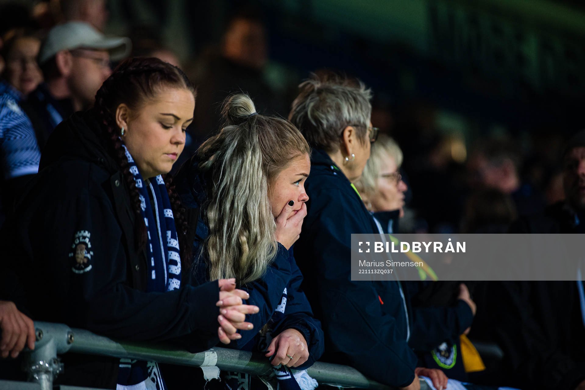 Spectators in the stands looks dejected