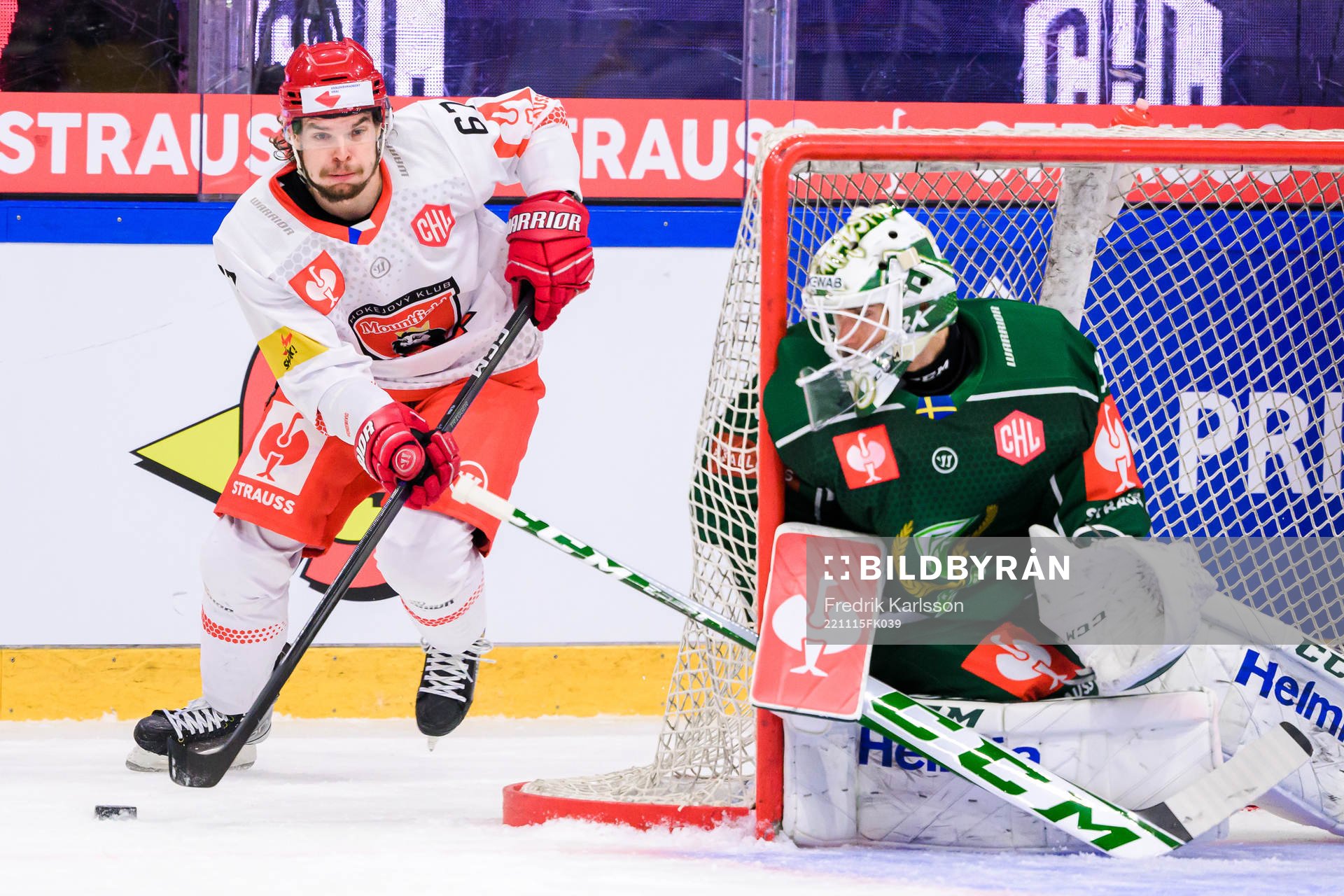Kelly klima of Mountfield and goaltender Matthew Tomkins