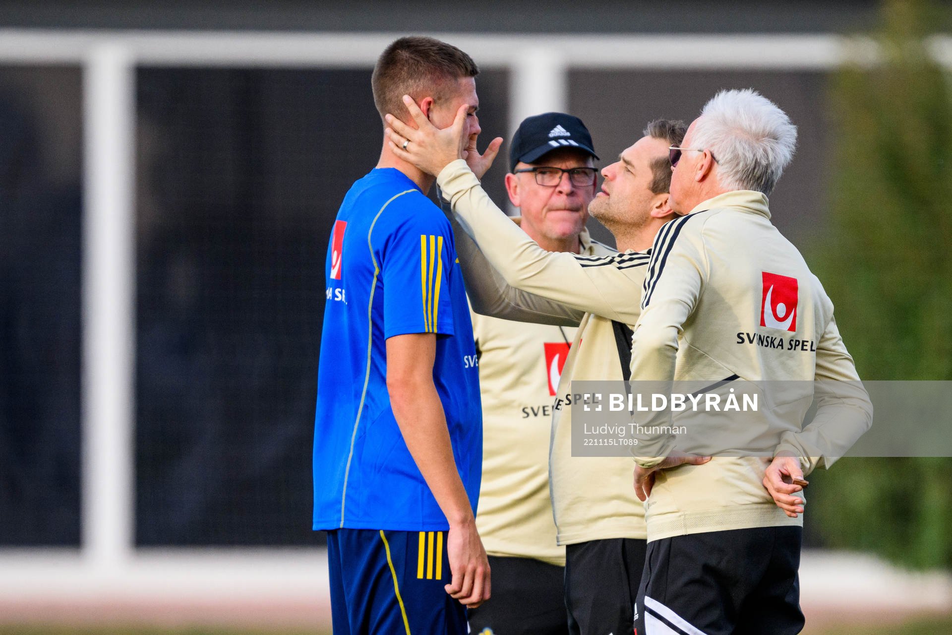 Emil Holm of the Swedish national football team is looked