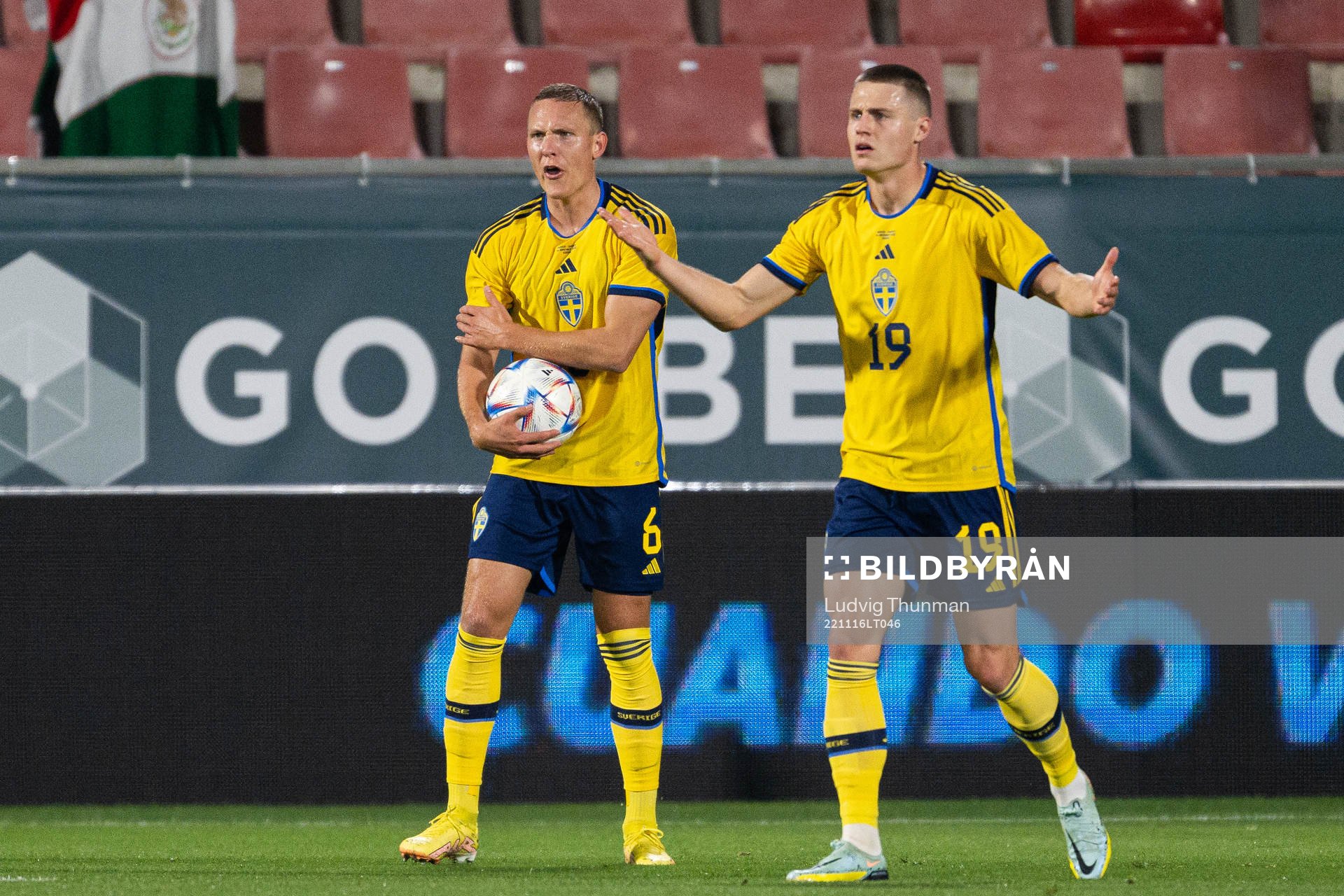 Ludwig Augustinsson and Mattias Svanberg of Sweden react