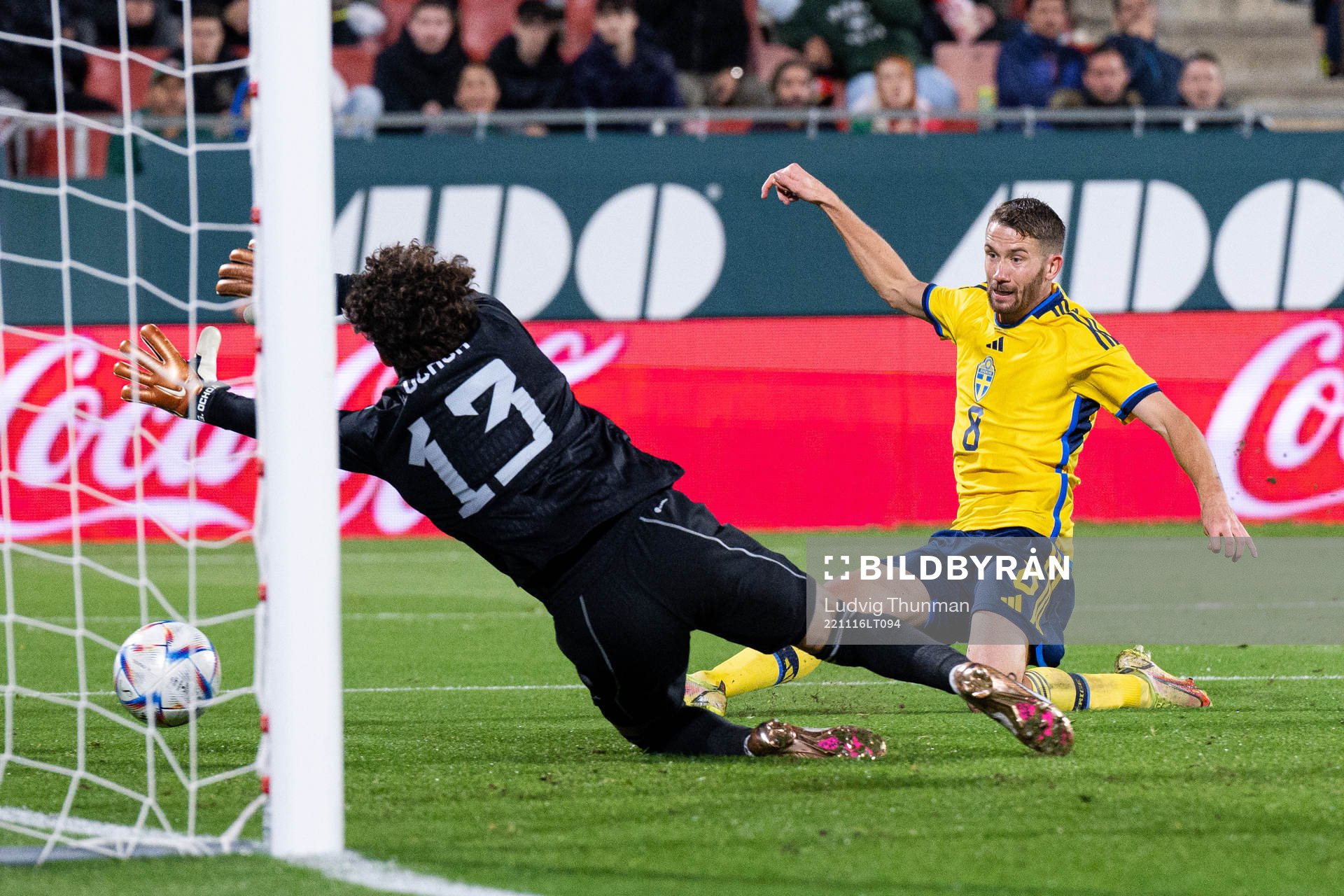 Marcus Rohdén of Sweden scores the 0-1 goal behind goalkeeper Guillermo Ochoa of Mexico during the international friendly football match between Mexico and Sweden on November 16, 2022 in Girona.