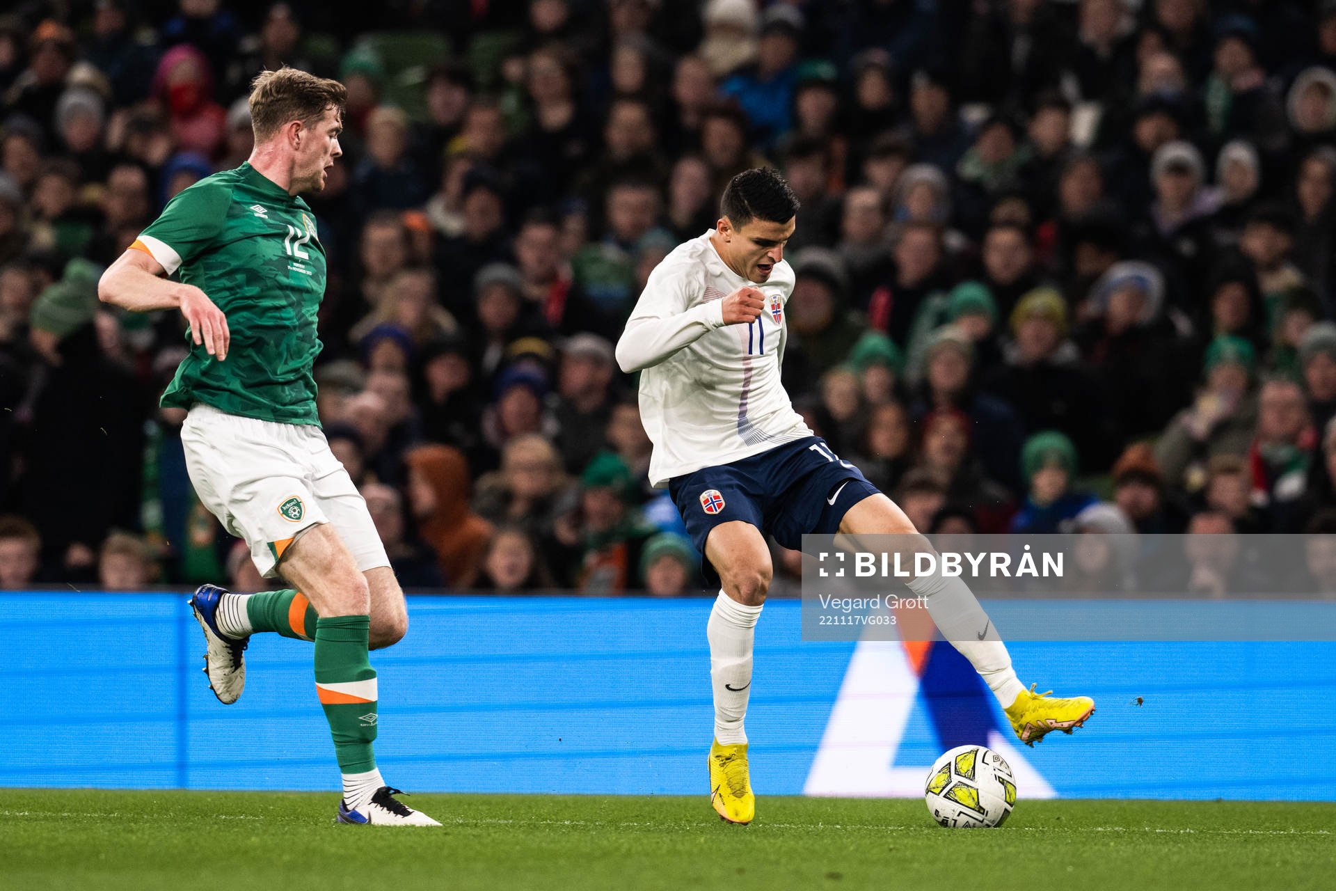 Nathan Collins of Ireland and goalkeeper Mads Hedenstad