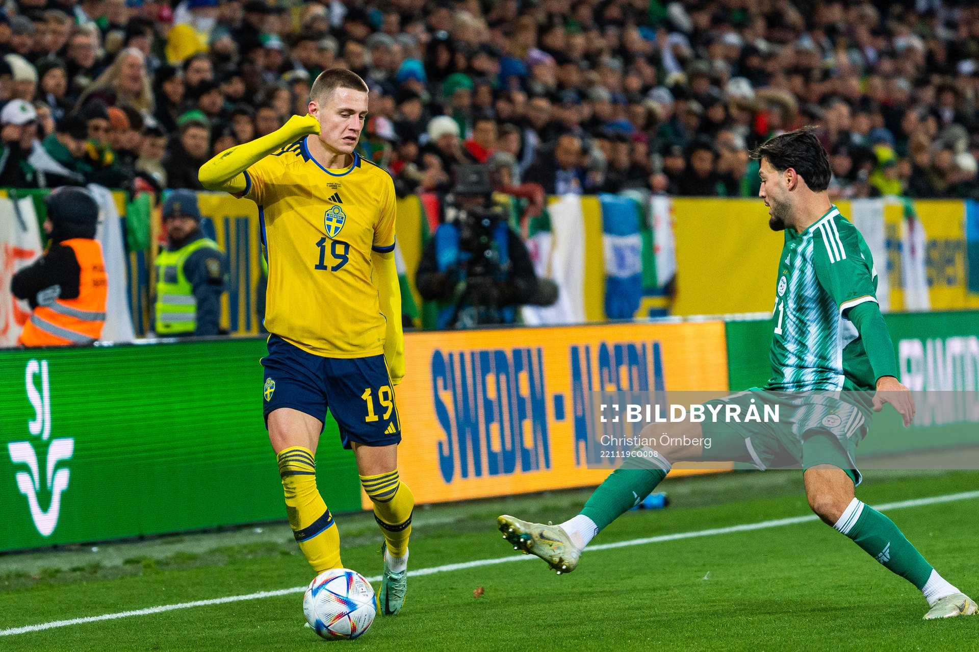 Mattias Svanberg of Sweden and Ramy Bensebaini of Algeria