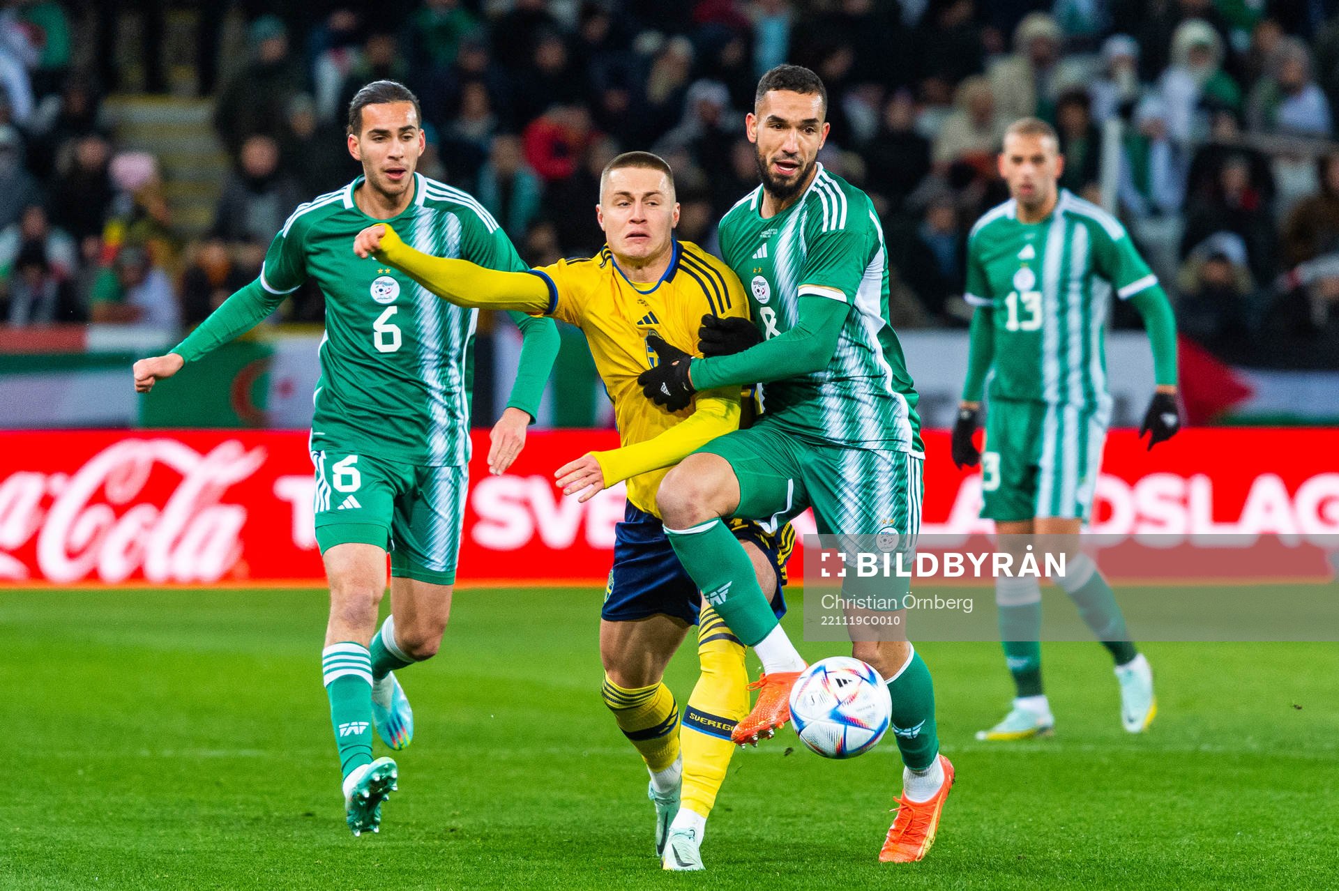 Mattias Svanberg of Sweden and Nabil Bentaleb of Algeria