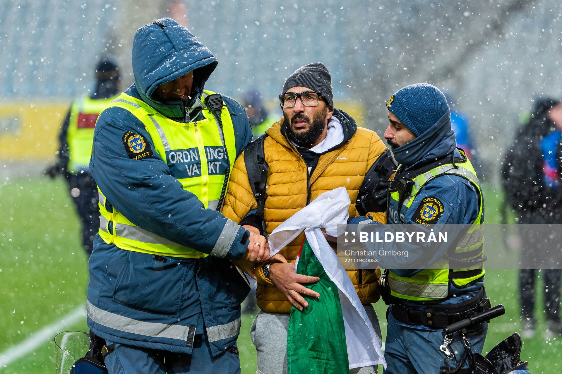 Security personel with a spectator
