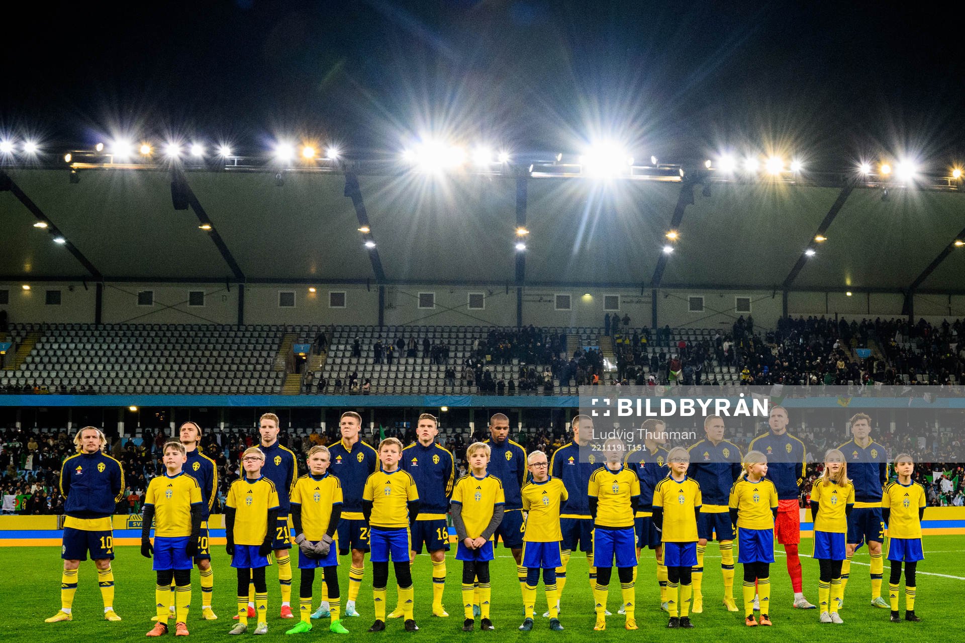 Players line up with player escorts