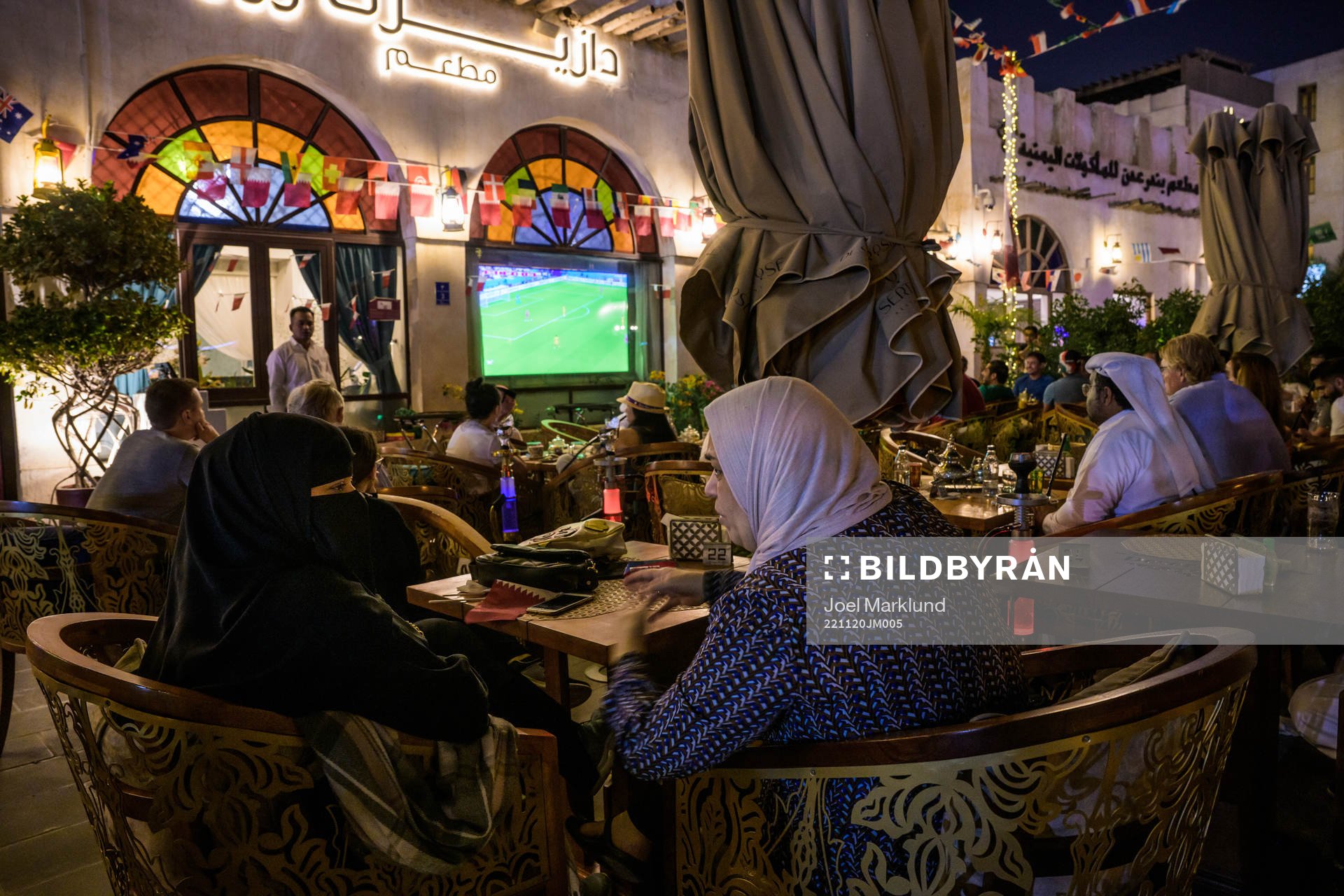 People watch the FIFA World Cup 2022 football match between