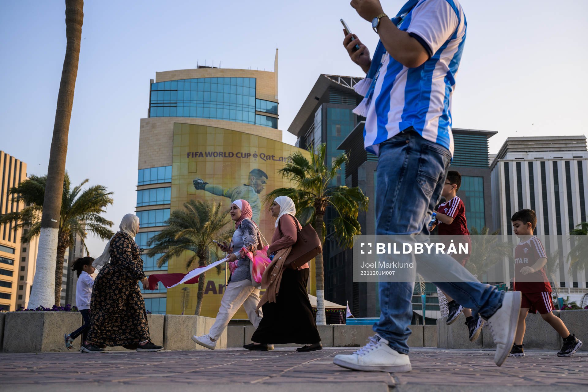 People walk past advertising