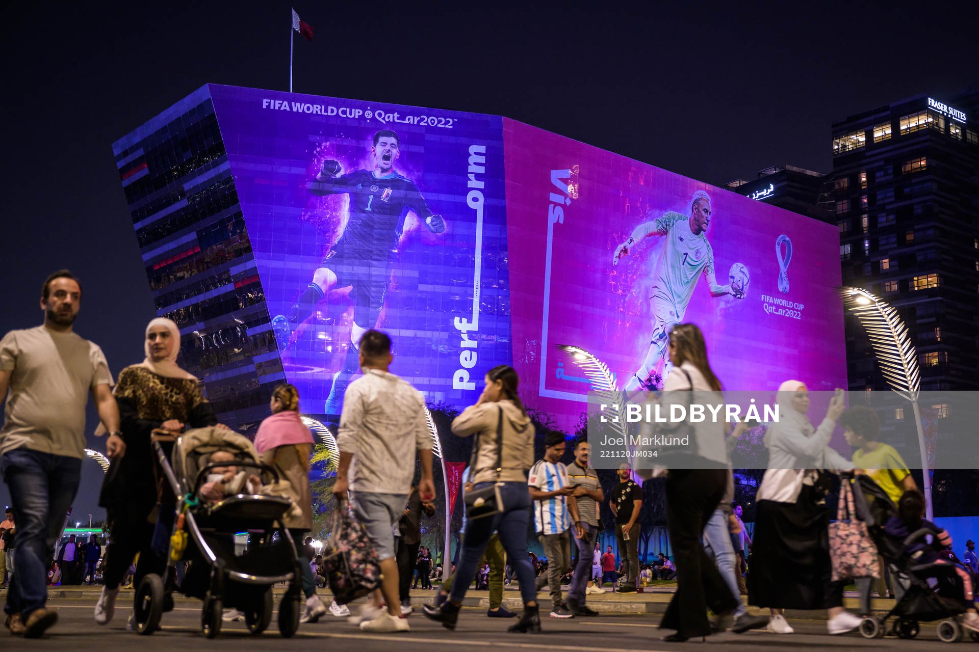 People walk past advertising