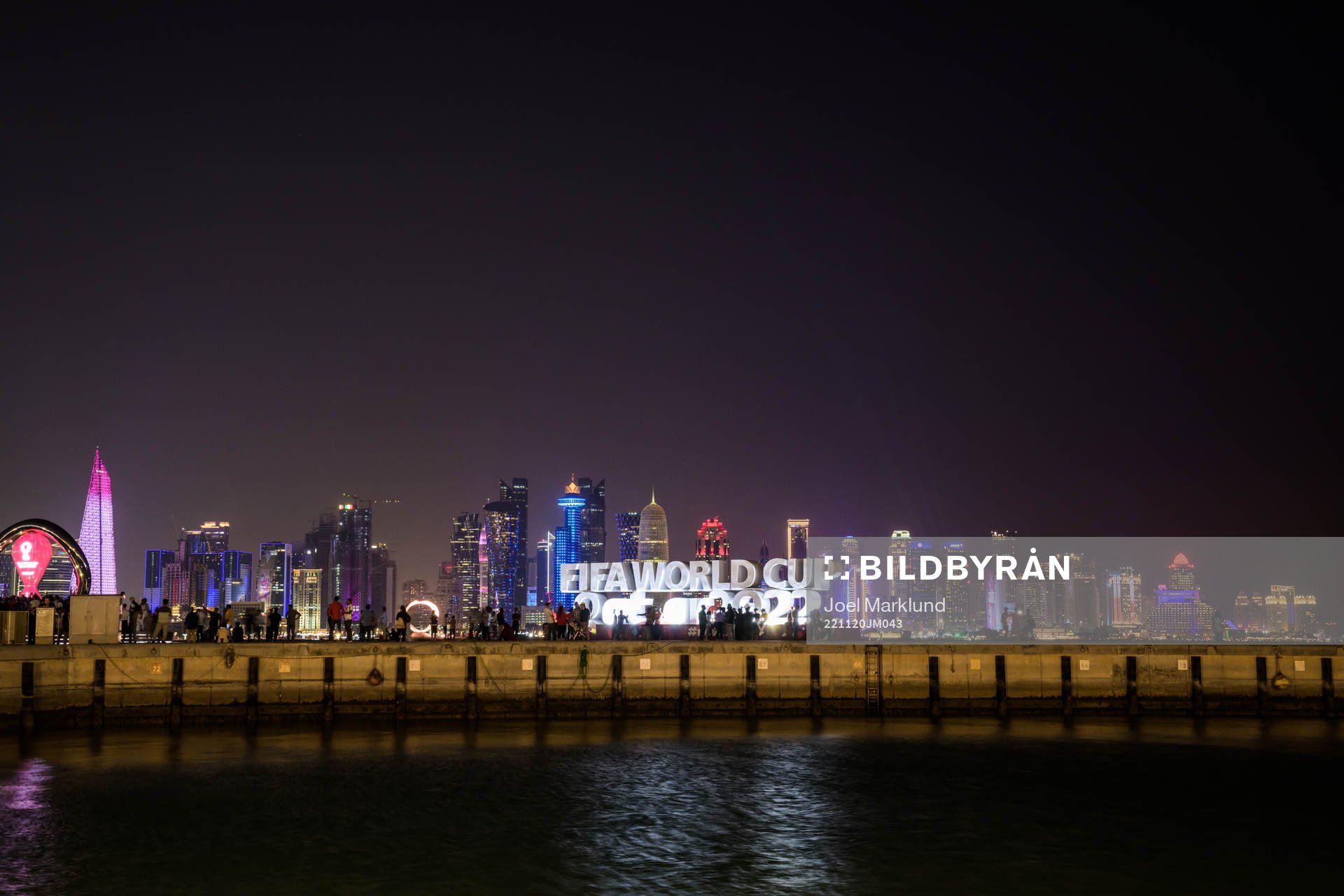 The city skyline seen behind a World Cup logo at Corniche