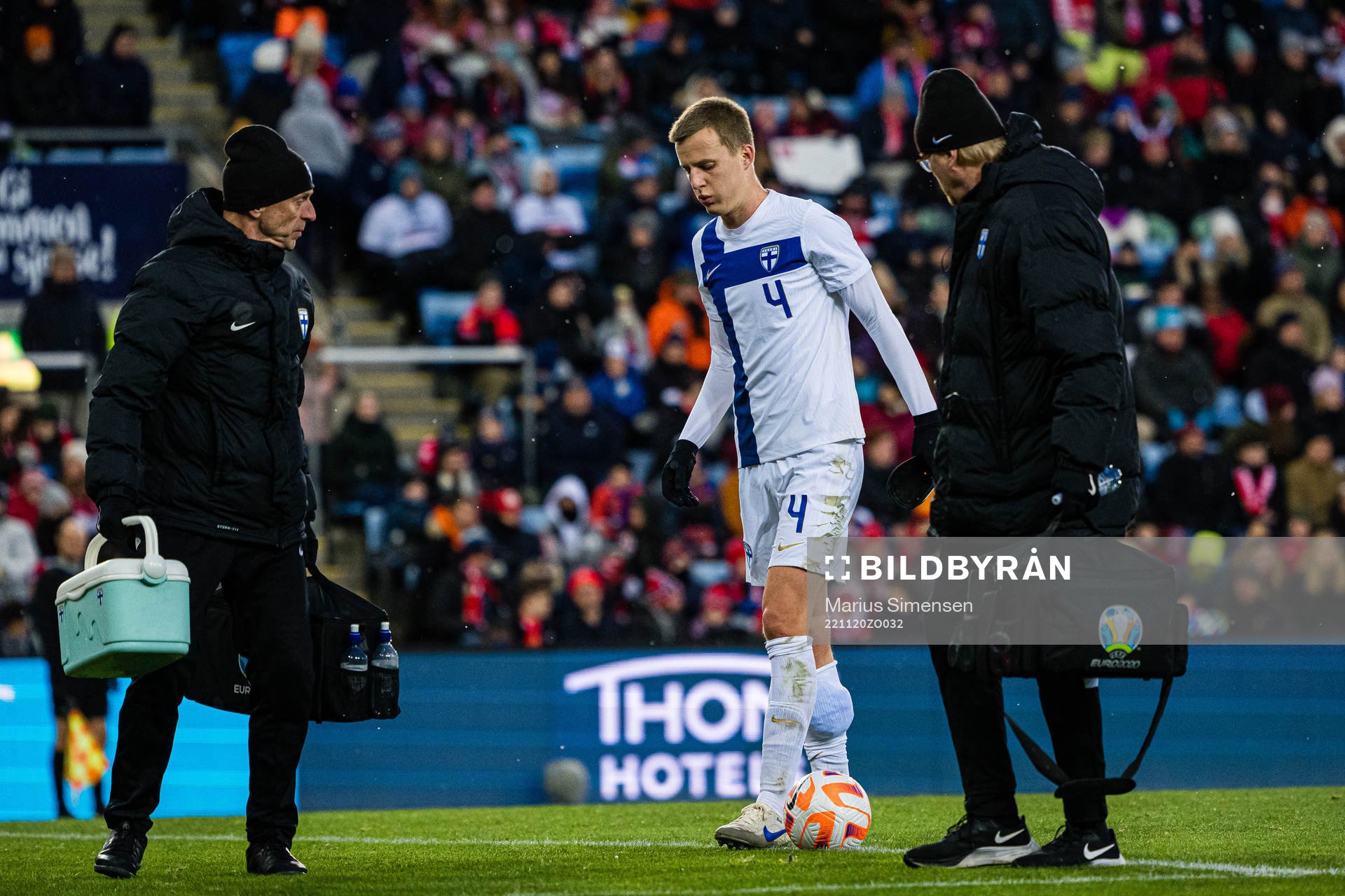 Robert Ivanov of Finland leaves the pitch with an injury
