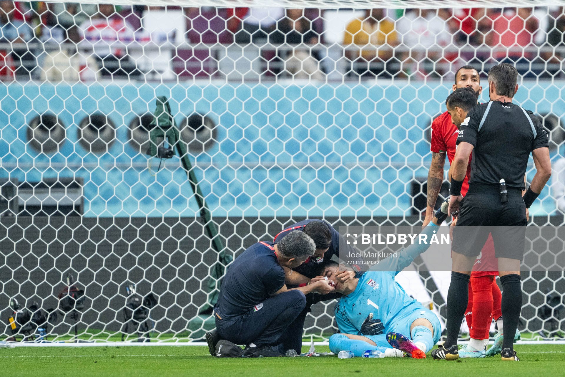 Goalkeeper Alireza Beiranvand of Iran receives medical
