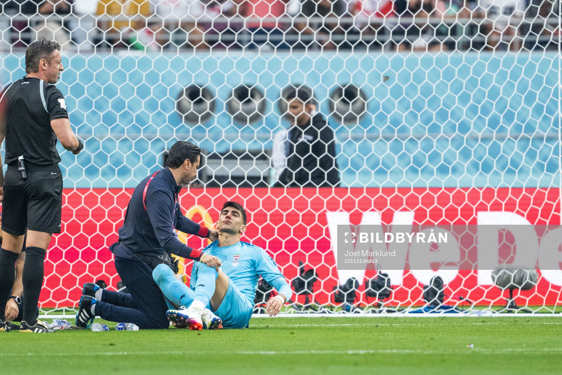 Goalkeeper Alireza Beiranvand of Iran receives medical