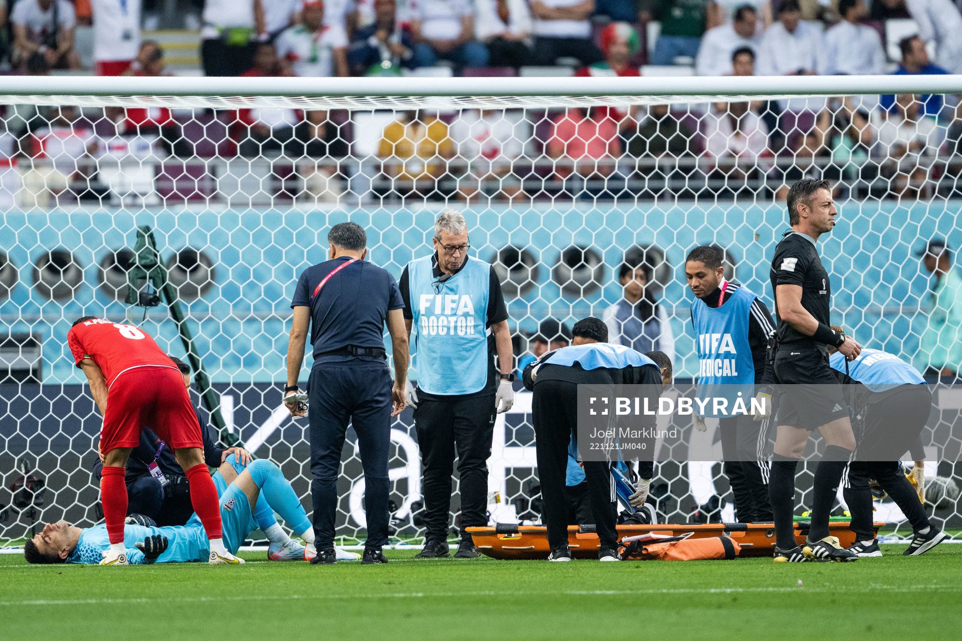 Goalkeeper Alireza Beiranvand of Iran receives medical