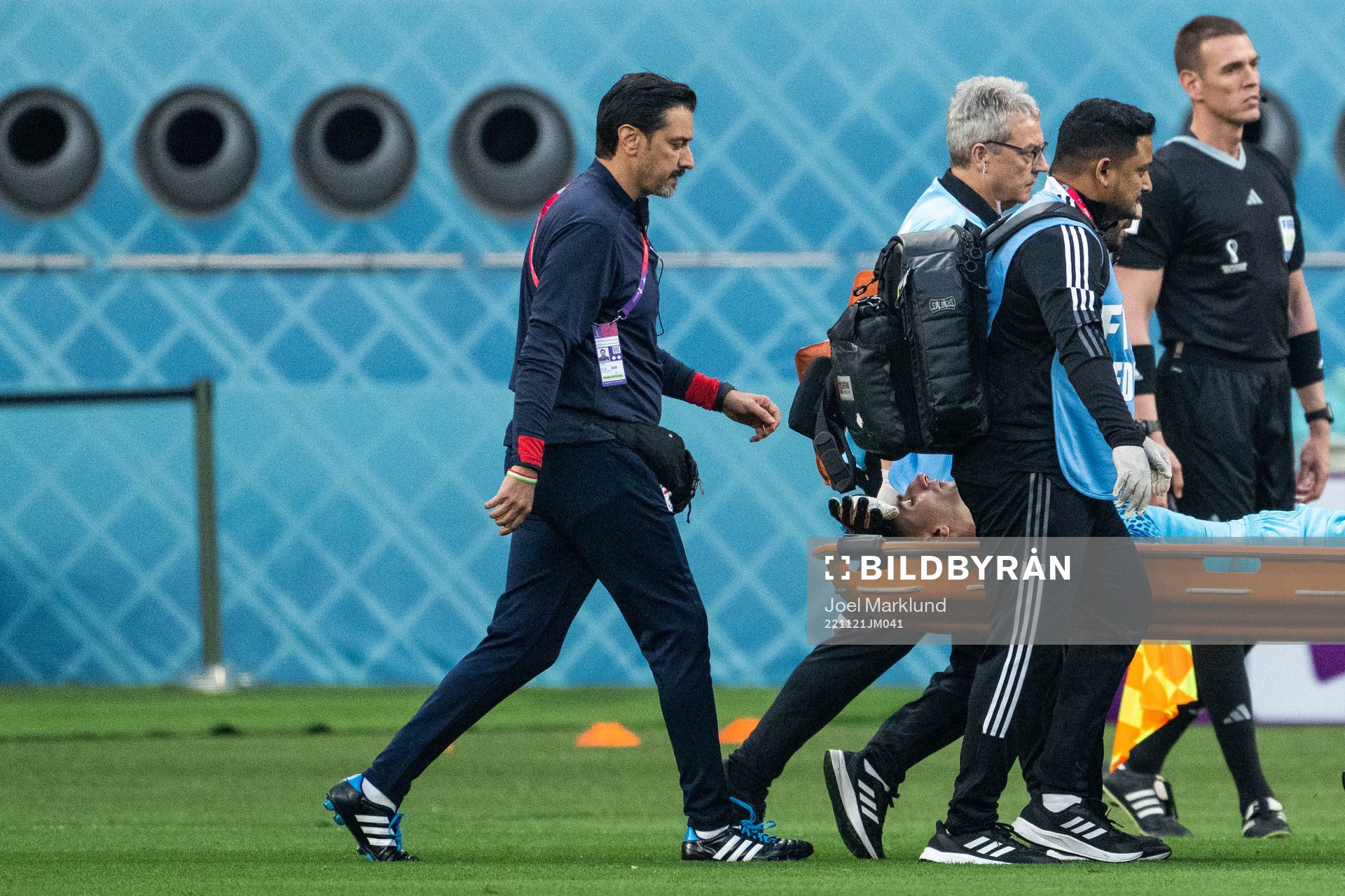 Goalkeeper Alireza Beiranvand of Iran is carried away in a