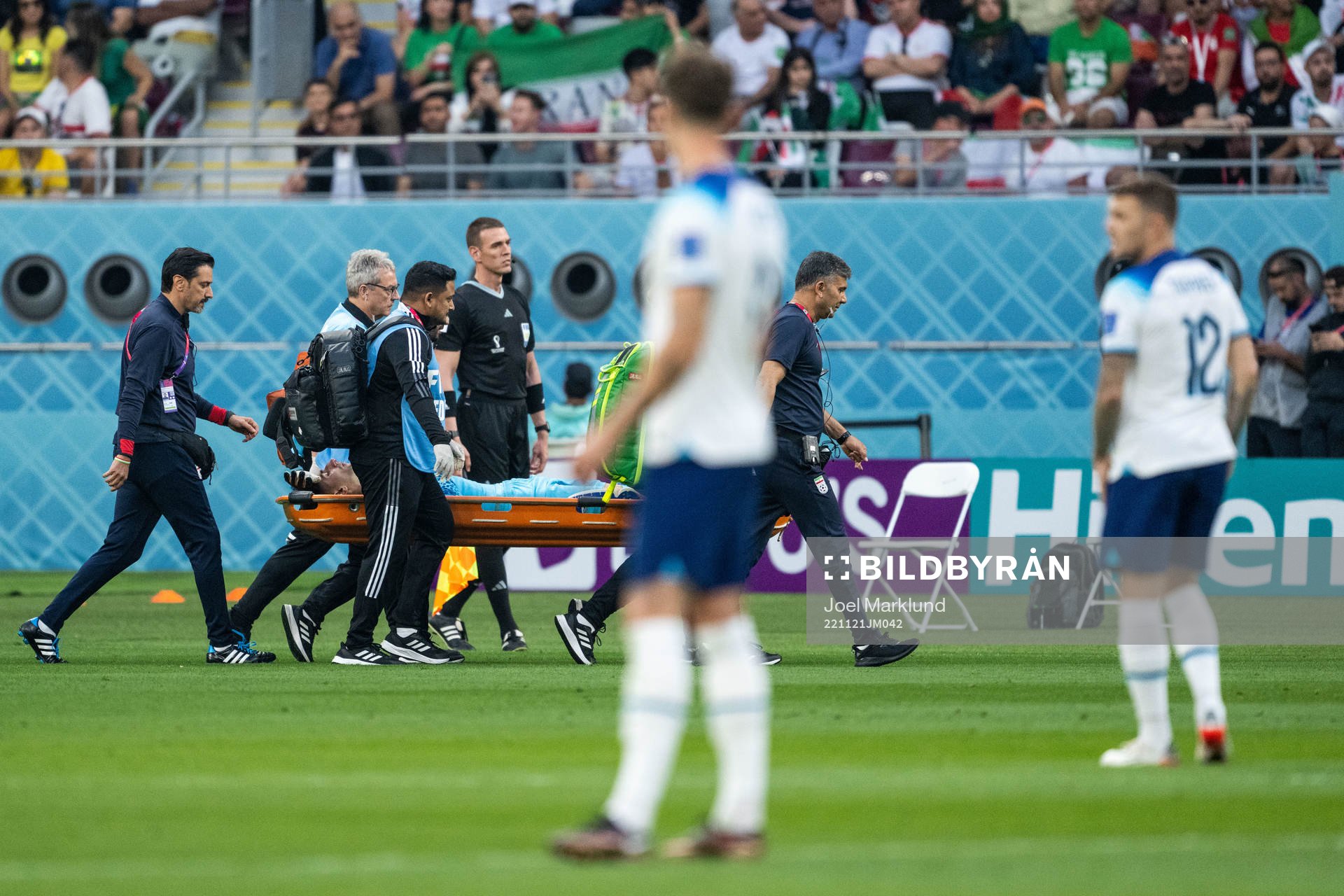 Goalkeeper Alireza Beiranvand of Iran is carried away in a