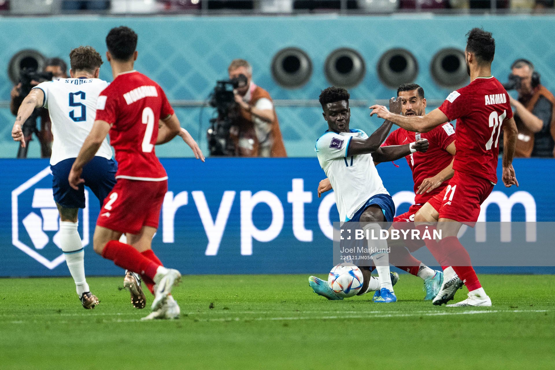 Bukayo Saka of England and Ehsan Hajisafi and Ahmad
