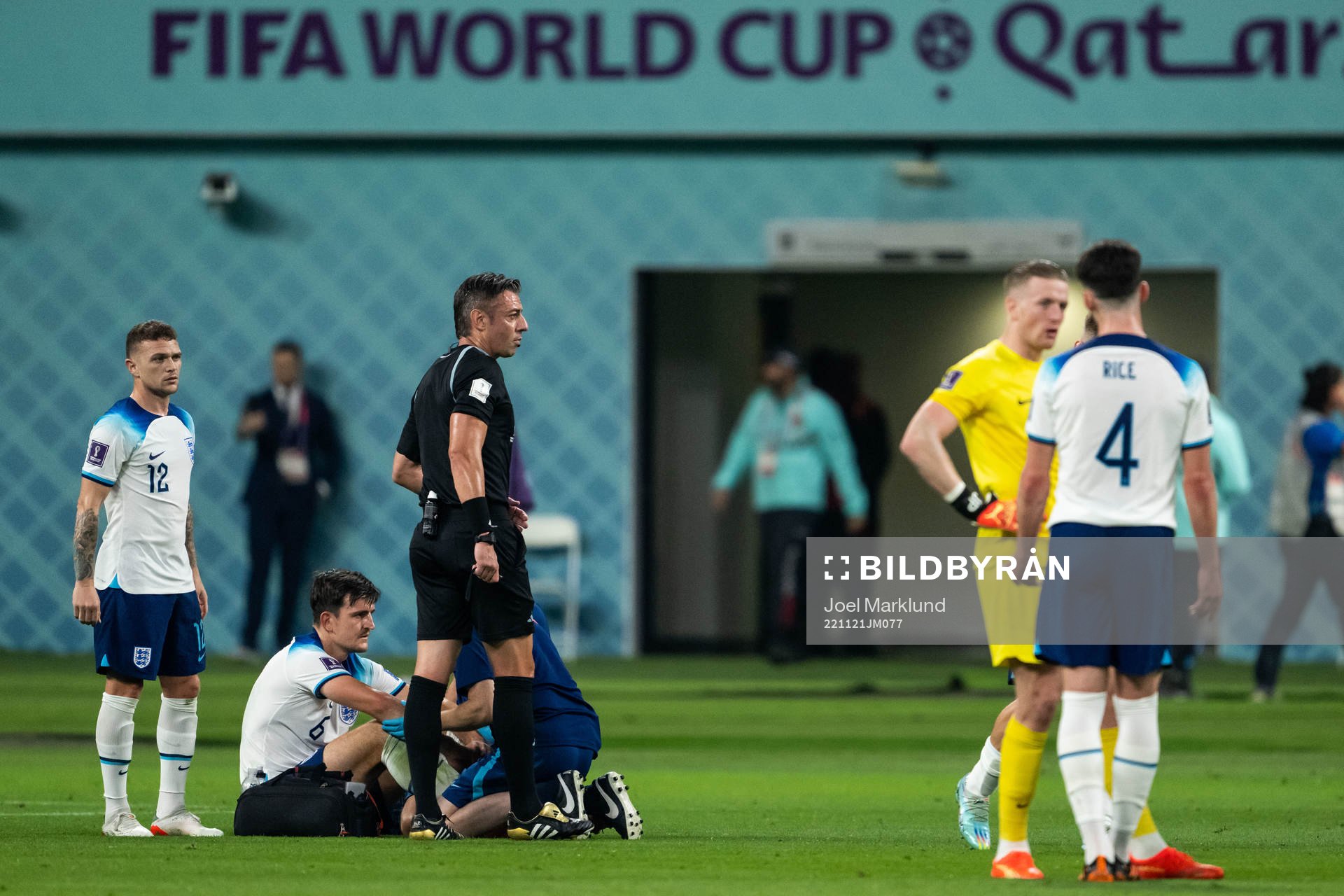 Harry Maguire of England receives medical attention