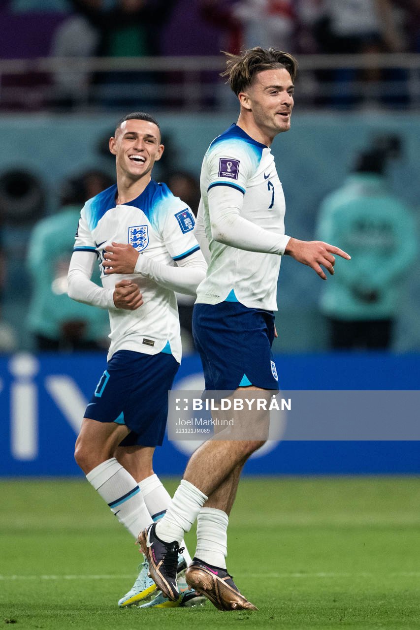 Phil Foden and Jack Grealish of England celebrate 6-1