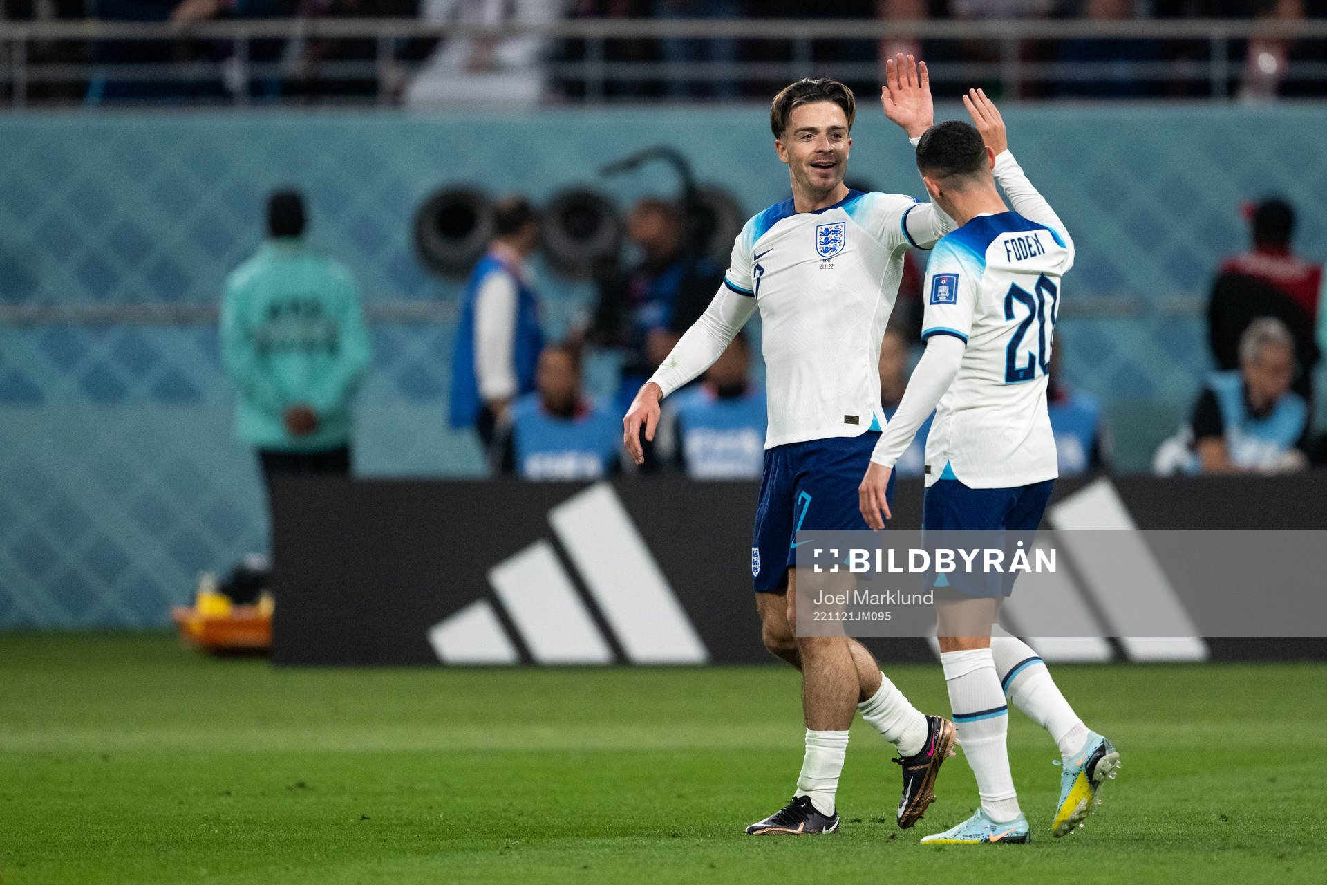 Jack Grealish and Phil Foden of England celebrate 6-1 during the FIFA World Cup 2022 football match between England and Iran on November 21, 2022 in Doha.