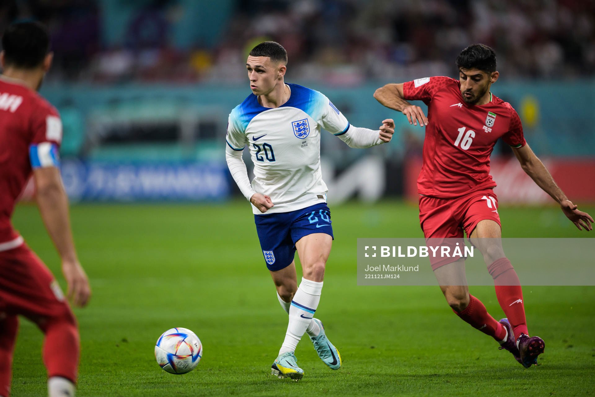 Phil Foden of England and Mehdi Torabi of Iran
