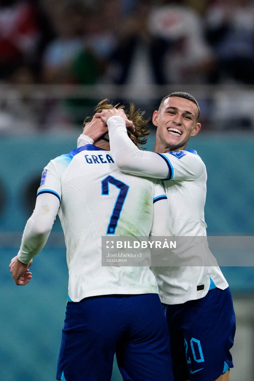 Jack Grealish and Phil Foden of England celebrate the 6-1