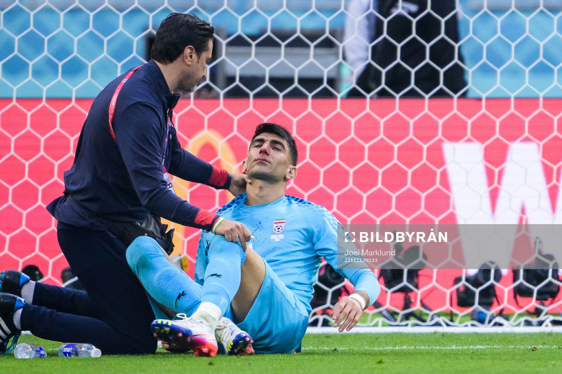 Goalkeeper Alireza Beiranvand of Iran receives medical