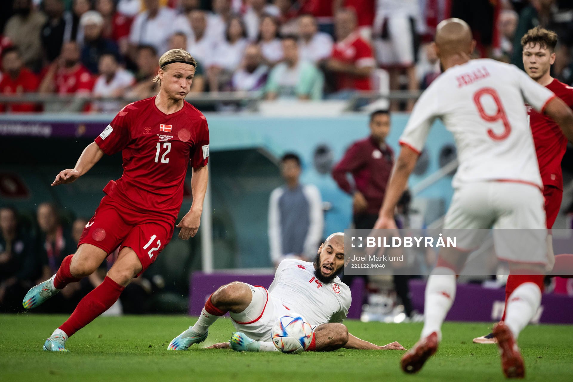 Kasper Dolberg of Denmark and Aissa Laidouni of Tunisia