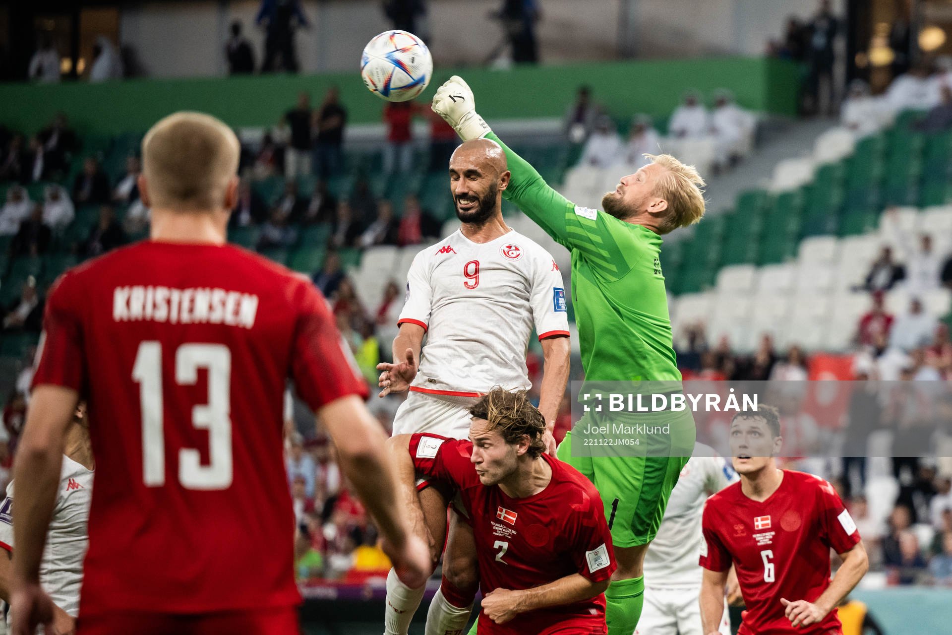Issam Jebali of Tunisia and goalkeeper Kasper Schmeichel of Denmark during the FIFA World Cup 2022 football match between Denmark and Tunisia on November 22, 2022 in Doha.