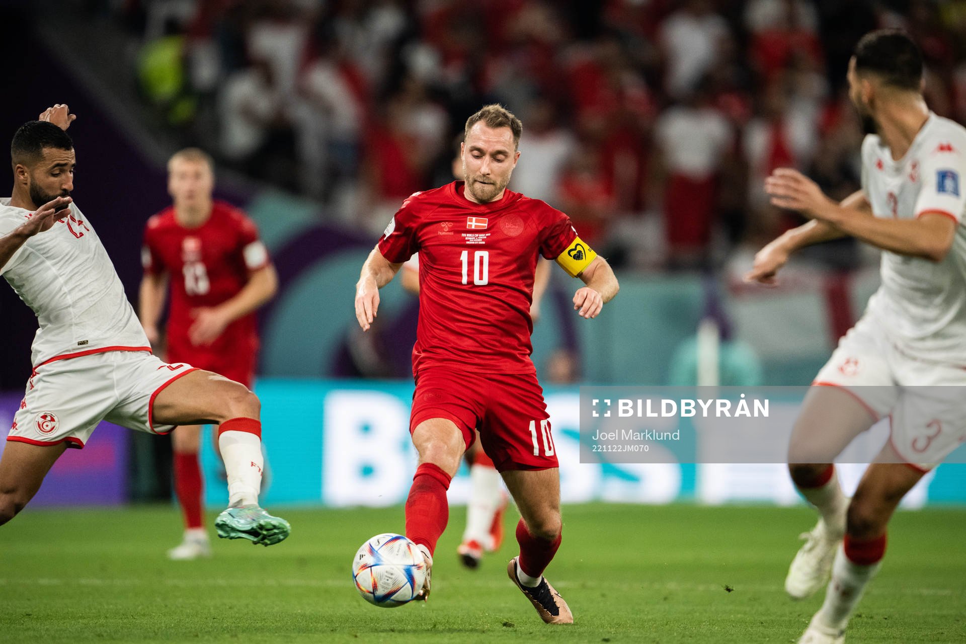 Ali Abdi of Tunisia and Christian Eriksen of Denmark