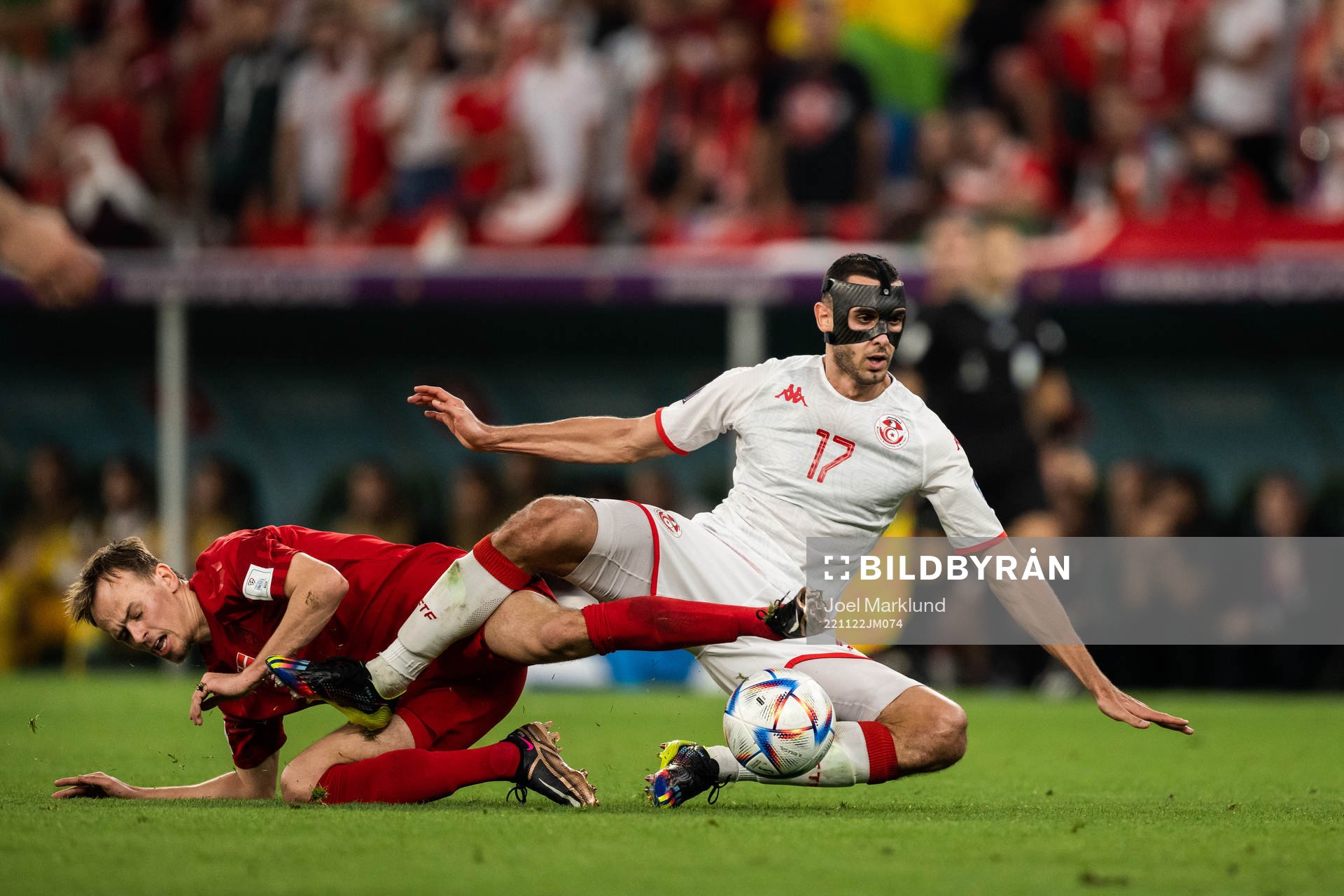 Mikkel Damsgaard of Denmark and Ellyes Skhiri of Tunisia