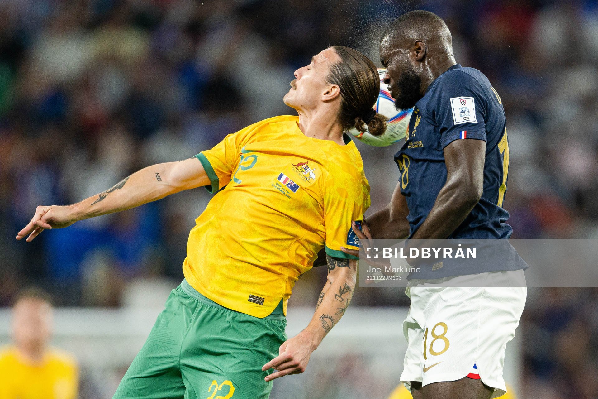 Jackson Irvine of Australia and Dayot Upamecano of France