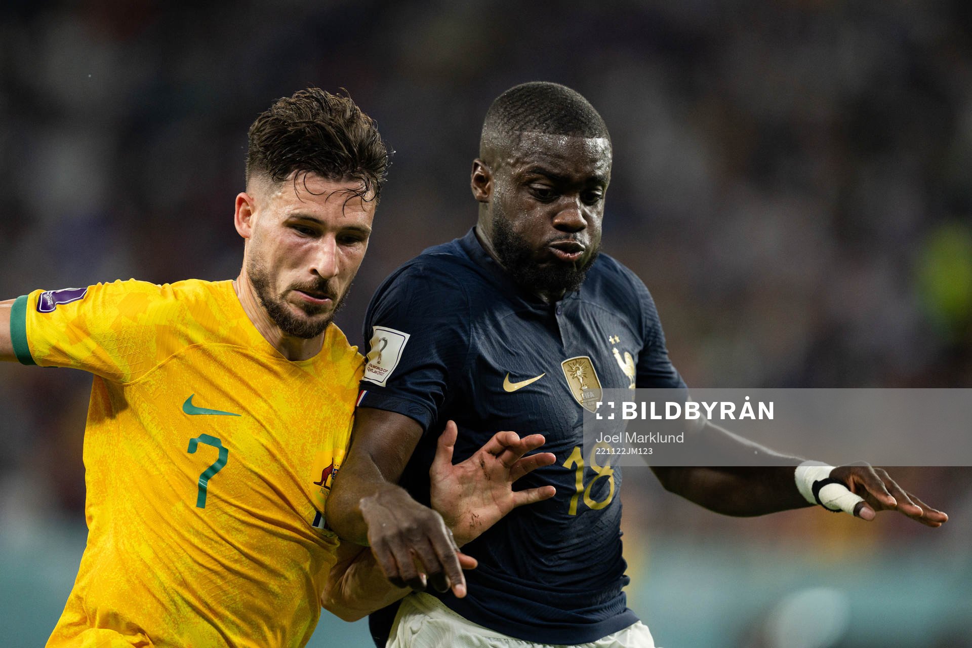 Mathew Leckie of Australia and Dayot Upamecano of France