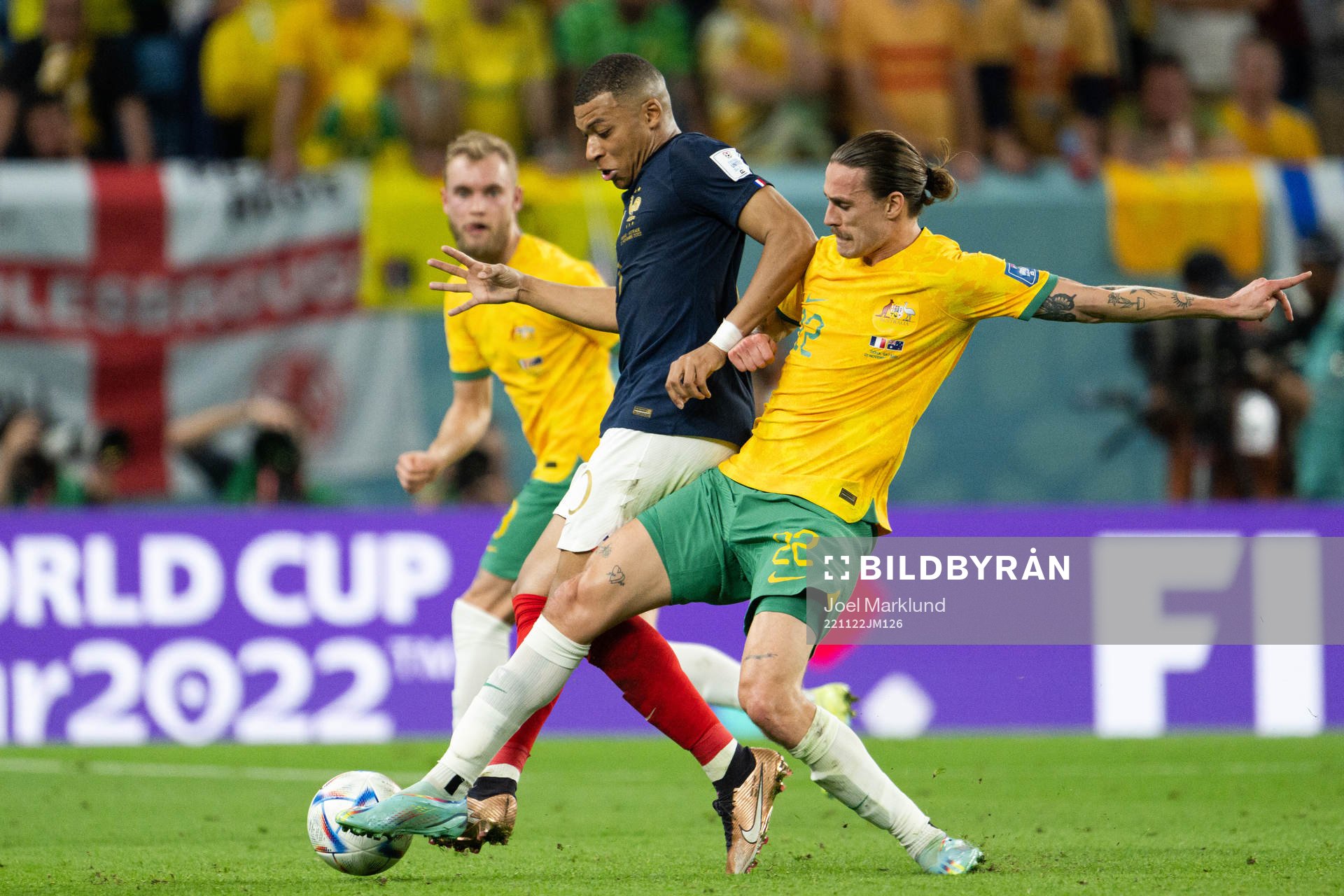 Kylian Mbappe of France and Jackson Irvine of Australia