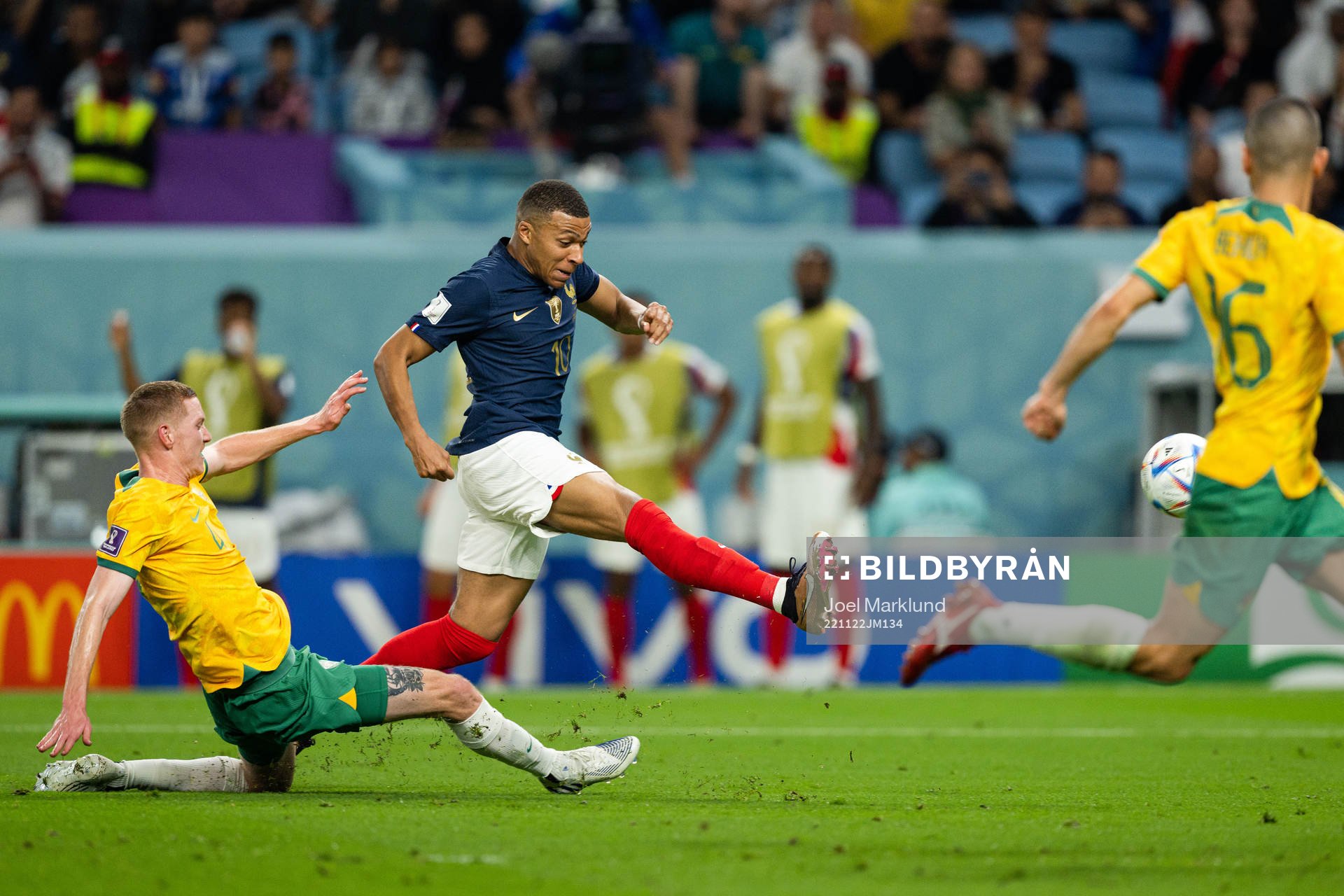 Kye Rowles of Australia and Kylian Mbappe of France