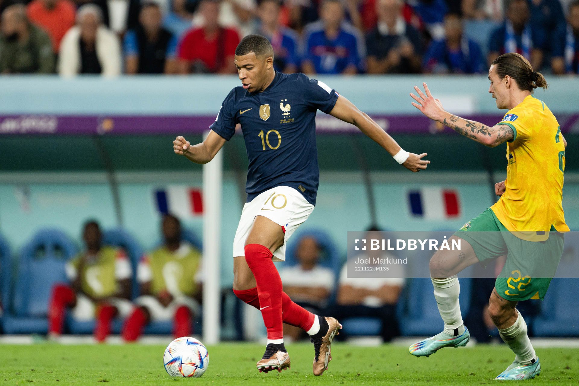 Kylian Mbappe of France and Jackson Irvine of Australia