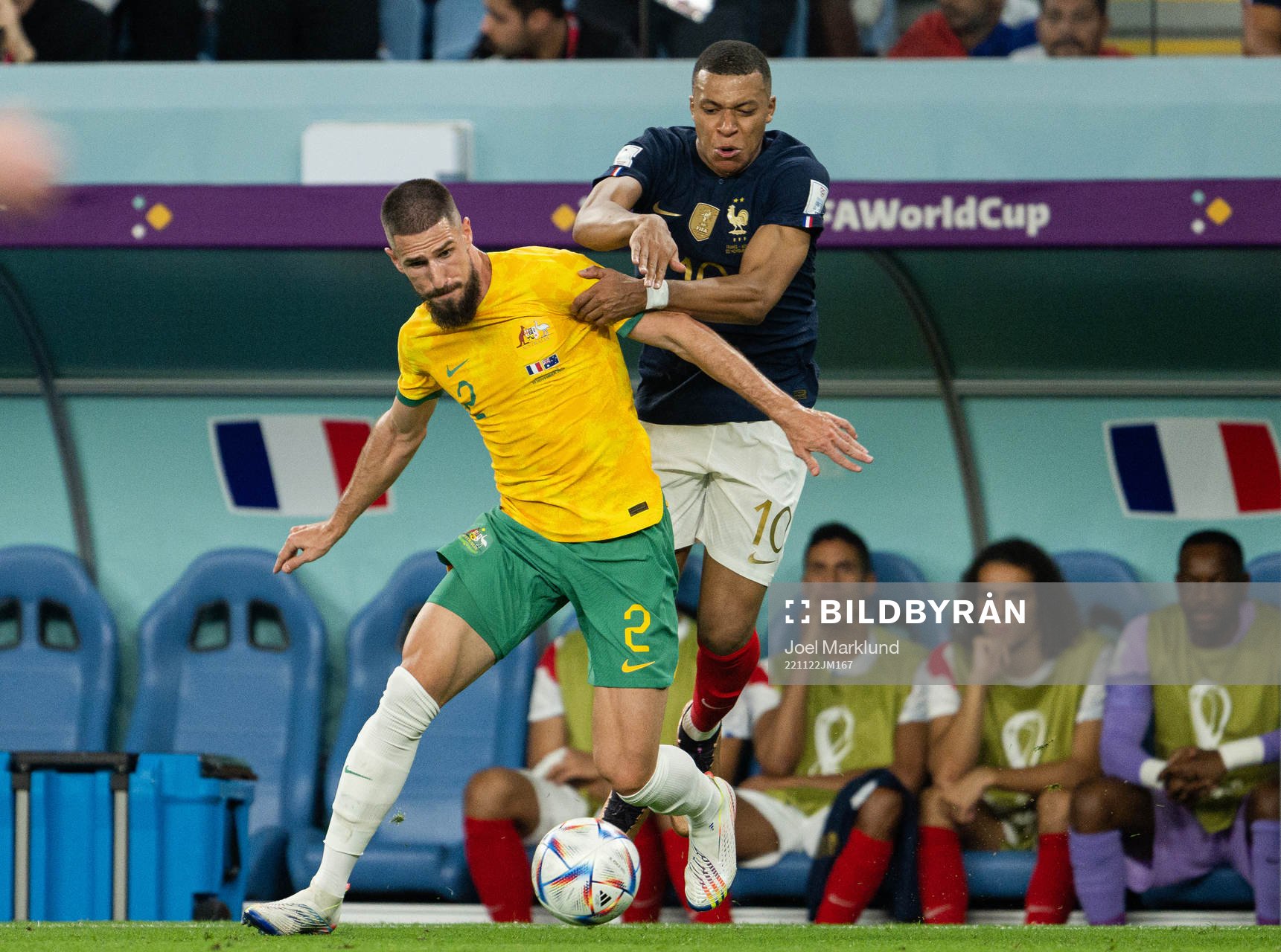 Milos Degenek of Australia and Kylian Mbappe of France