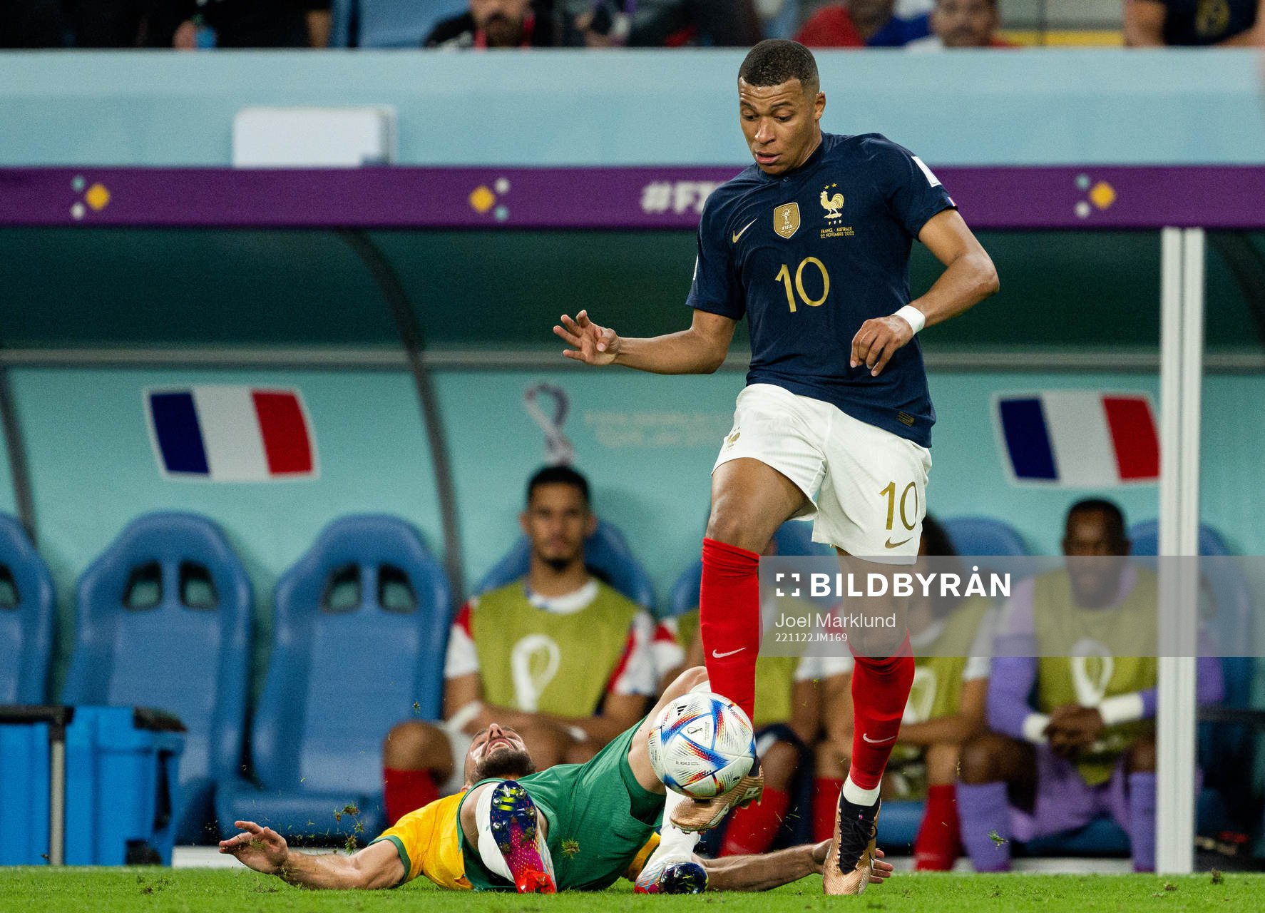 Milos Degenek of Australia and Kylian Mbappe of France